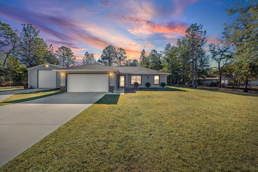 Why wait to build when you can have better than brand new? This meticulously maintained 1,390 sq ft, 3 bedroom, 2 bath home sits on just over an acre and offers modern construction with a thoughtfully designed split floor plan. The open concept living area is highlighted by vaulted ceilings and natural light throughout, creating a welcoming atmosphere. Kitchen features granite countertops, a large center island, and ample cabinetry, providing a functional space for entertaining. Privately positioned, the primary suite includes a walk in closet and an ensuite bath with a walk in shower. The split floor plan features two spacious guest bedrooms with a conveniently located guest bathroom positioned between them. A standout feature is the 20x25 metal shop, complete with concrete floors, a 10x10 roll up door with opener, a 20 foot built in workbench, 16 foot steel shelving, a 5 HP 60 gallon stationary air compressor, and plenty of space for tools, hobbies, or recreational vehicles. The attached 2 car garage offers additional storage and parking. Outside, enjoy a private setting with mature trees and a partially fenced chain link backyard, ideal for pets and outdoor enjoyment. Ownership includes access to Rainbow Springs Country Club amenities, including a community pool, clubhouse with event spaces, fitness center, restaurant, and exclusive access to a private 3 acre river park on the Rainbow River. Conveniently located close to shopping, restaurants, and schools, and just minutes from Rainbow Springs State Park, this property offers the perfect blend of space, privacy, and a highly desirable lifestyle. Schedule your private showing today!