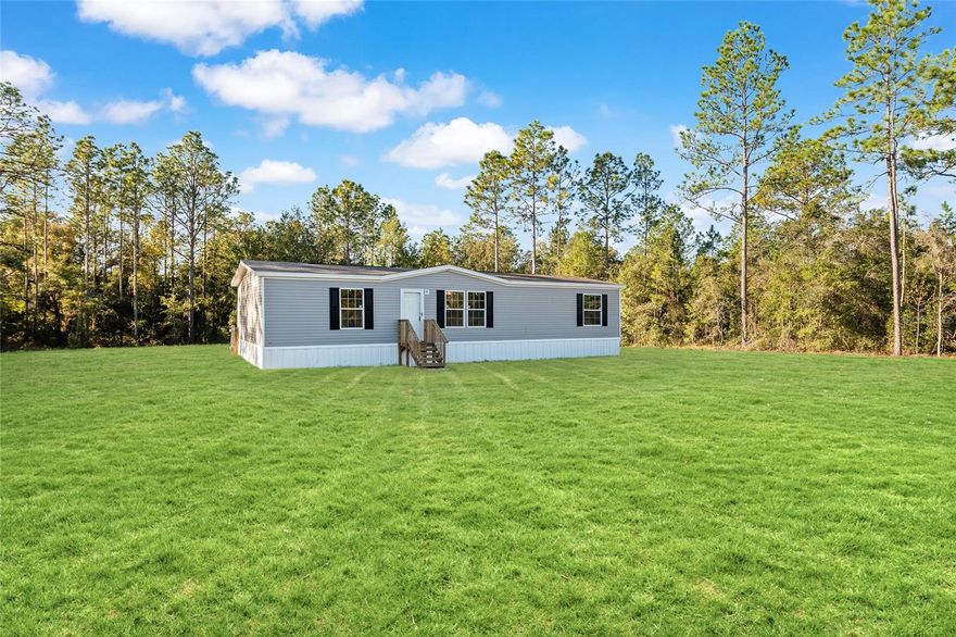 Brand New 2025 Doublewide in Williston Highlands!

Welcome to your new home in the peaceful community of Williston Highlands! This brand new 2025 doublewide offers 3 spacious bedrooms and 2 full baths, perfectly designed with modern living in minincluding Fiber Optic Internet. Step inside to an open-concept floor plan filled with natural light, featuring a stylish kitchen with stainless steel appliances, ample cabinetry, and a large center island ideal for entertaining.

A convenient mud/laundry room adds extra functionality, keeping daily life organized. The owner’s suite provides a private retreat with a walk-in closet and en-suite bath, while two additional bedrooms offer flexibility for family, guests, or a home office.

Nestled on one full acre, there’s plenty of room to create your own outdoor oasis—whether it’s a garden, play area, or space for hobbies. Enjoy the tranquility of country living with the convenience of being just minutes to downtown Williston, shopping, dining, and a short drive to Gainesville and Ocala.

Don’t miss the opportunity to own this beautiful, move-in ready home in a growing area!
