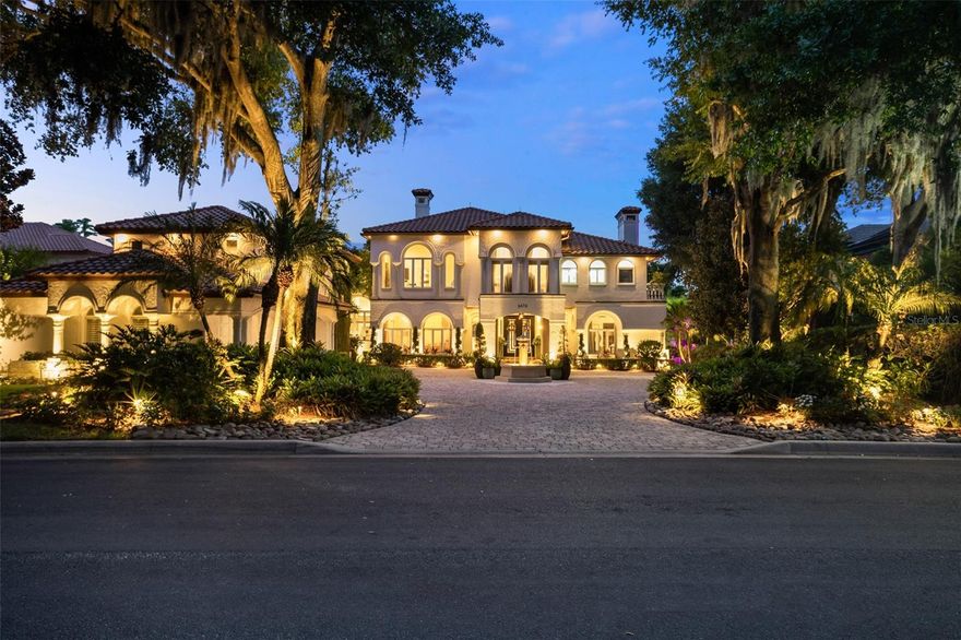 Within the gates of Isleworth, on beautiful Lake Chase among the Butler Chain of Lakes, sits this exquisite estate offering the best of Florida waterfront living. The six-bedroom, five and a half bath home is located adjacent to the driving range and tennis center, and is in close proximity to the renowned Isleworth Golf & Country Club house. Boasting an updated interior spanning more than 5,800 square feet, the estate offers spacious, light-filled rooms showcasing a phenomenal mix of fine finishes which create a home that is chic, stylish and relaxing. From the formal foyer featuring breathtaking views, to the dining room, open kitchen, breakfast nook and large family room, the sprawling floor plan captures exquisite vistas at every turn. The second-floor primary suite overlooks an outdoor oasis with views of Lake Chase, and the primary bath holds an oversized walk-in shower as well as an additional laundry room. Two home offices has separate workspace options. A private guest suite opening to a kitchenette and loft area conveniently rounds out the additional spaces in the home. Enjoy numerous outdoor dining and lounging areas and summer kitchen, along with the grounds featuring an open-air swimming pool, heated spa and boat dock.
