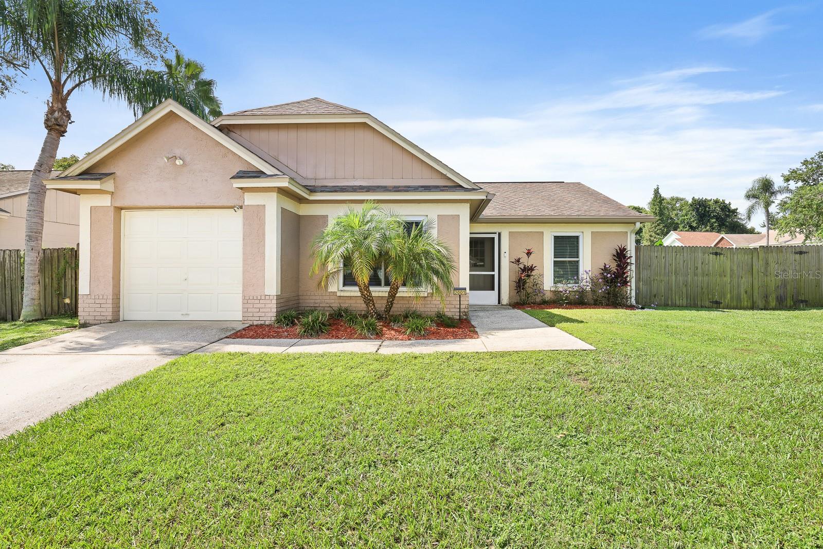 Welcome to this charming single-family home perfectly situated on a desirable corner lot in Valrico. Offering 1,244 Sq Ft, 3 bedrooms, 2 bathrooms, and a 1-car garage, this residence has been thoughtfully updated to provide both style and comfort. At the heart of the home, the beautifully refreshed kitchen features gorgeous stone countertops and appliances updated in August 2022, creating a space that is both functional and inviting. The main living area is enhanced by durable laminate flooring, while the bedrooms offer comfort with plush carpet. Recent updates bring peace of mind, including a new HVAC system installed in February 2025, a hot water heater replaced in 2022, and fresh interior and exterior paint completed in August 2022. Step outside to enjoy a fully fenced backyard with plenty of room for outdoor activities, along with a covered and screened lanai—ideal for relaxing or entertaining. An 8’ x 12’ double loft-style storage shed provides additional space and conveys with the sale, as do the washer and dryer. Conveniently located close to a wide variety of shopping and dining options, and with easy access to the Cross Town Expressway and I-75, this home offers the perfect balance of comfort, updates, and accessibility.