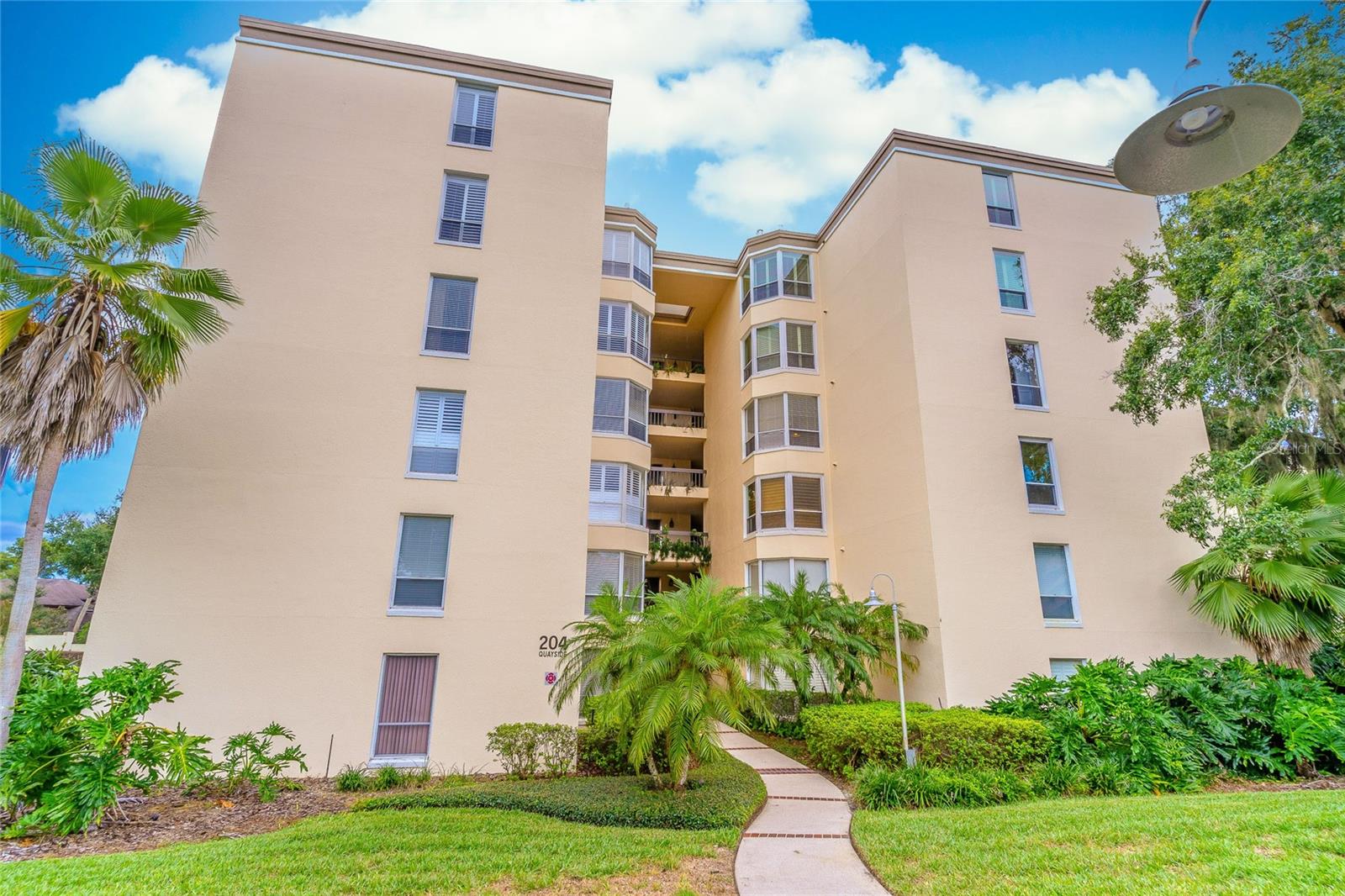 Penthouse Living at The Moorings on Lake Maitland – 204 Quayside Cir #604
Welcome to your dream home in the highly desirable community of The Moorings on Lake Maitland. This rarely available 2 bed/2 bath penthouse unit truly offers a exceptional blend of comfort, style, and location in the heart of one of Central Florida’s most sought-after lakefront communities. Entering the unit just steps from the elevator, you’re met with a bright open living space complimented by 16ft cathedral ceilings and an abundance of natural light. Enjoy beautiful views from your private balcony – the perfect spot for morning coffee or winding down at sunset. The unit includes an assigned covered parking space offering protection for your vehicle in any weather condition. The storage room just down the hall from the front door adds a fantastic touch of convenience to the overall charm the home offers. Living in The Moorings is a serene lakeside lifestyle with top-tier amenities, including a community pool, clubhouse, and beautifully landscaped grounds with direct access to Lake Maitland, part of the prestigious Winter Park Chain of Lakes. Don’t miss this opportunity to own a penthouse in one of Maitland’s premier communities – where charm, location, and lifestyle come together. Schedule your private showing today!