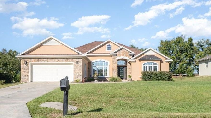Welcome to the sought-after community of Majestic Oaks! This beautifully updated 4-bedroom, 3-bath home in Ocala offers over 2,700 sq. ft. of spacious living. The interior features laminate flooring in the main living areas, tile in the kitchen, built-in bookcases, ceiling fans, and a custom tray ceiling in the living room that opens to the kitchen. The newly renovated kitchen (January 2025) boasts custom backsplash, new granite countertops, a modern sink with glass rinser, and stainless steel appliances (installed December 2024), including a refrigerator with sphere ice maker. Enjoy peace of mind with a 2023 roof and a versatile flex space perfect for a home office or den. The primary suite offers dual walk-in closets, dual vanities with retractable faucets, and a luxurious walk-in shower. Fresh interior paint (2024) adds a clean, inviting feel throughout. Step outside to your private Florida retreat featuring a fully screened solar-heated pool, a new drain field (December 2024), fenced backyard, rain gutters, and upgraded garage lighting. This well-maintained home blends indoor comfort with outdoor enjoyment. Conveniently located near shopping, dining, and recreation—this move-in ready home is a must-see! Schedule your showing today!