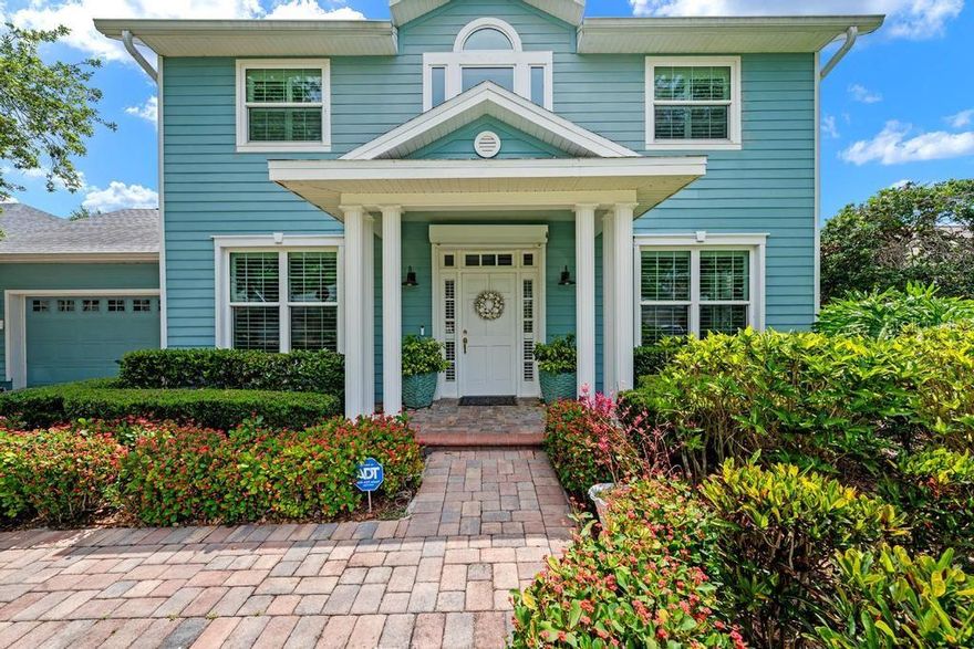 Rarely does a home come to market that has been curated with such impeccable taste and attention to detail. More reminiscent of the Hamptons than Bradenton, this exceptional residence offers coastal sophistication just minutes from the stunning Gulf beaches.

This charming two-story home features a first-floor ensuite bedroom complete with a marble-top vanity and walk-in shower, a formal dining room, and a beautifully renovated kitchen designed for both elegance and functionality. Imported Italian subway tile, stainless steel appliances, a Bosch dishwasher, induction cooktop, Advantium convection microwave, GE Profile oven, and oversized LG refrigerator all come together seamlessly. Soft-close cabinetry and pull-out pantry storage maximize convenience, while a reverse osmosis water system services the sink, refrigerator, and ice maker.

The sunny breakfast nook, framed by three windows, includes a custom built-in banquette with hidden storage below, and the adjacent high-top bar comfortably seats 4–5 guests. Completing the main living area is a warm and inviting family room with custom built-ins. Wood flooring runs throughout the home, including hand-scraped Anderson maple floors downstairs.

Upstairs, behind elegant French doors, the primary suite is a true retreat featuring vaulted ceilings, a private sitting area, and a fully renovated spa-inspired ensuite bath worthy of a luxury boutique hotel. Two additional bedrooms share an updated bath with tub and shower.

This home is as practical as it is beautiful. Impact-rated front windows, including the dramatic picture window in the vaulted foyer, provide peace of mind, while all remaining windows and doors are protected by attached hurricane shutters. Additional upgrades include a whole-house GENERAC generator powered by two 120-gallon propane tanks and remote-controlled impact shades protecting the rear lanai.

The list of special features continues: a custom outdoor shower and dressing area, Hunter Douglas plantation shutters throughout, tandem garage with workshop space, 80-gallon hybrid water heater, heated saltwater pool, and an incredibly private backyard designed perfectly for entertaining family and friends.

With countless thoughtful upgrades throughout, this enchanting property is ideally located near Robinson Preserve and just minutes from the world-famous beaches of Anna Maria Island.