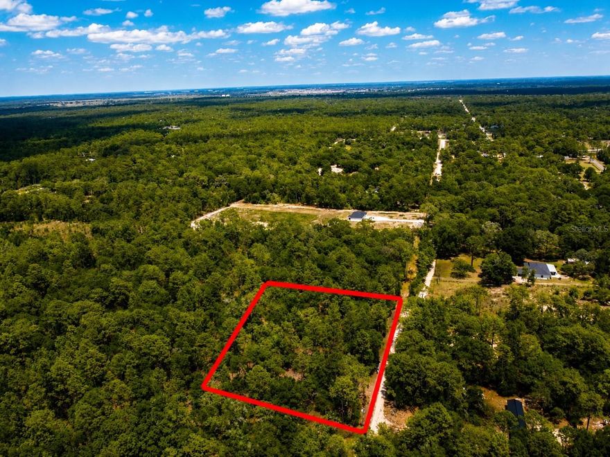 Discover the perfect blend of privacy and convenience with this beautiful 2.3-acre wooded lot ideally located near the Dunnellon/Ocala line. Tucked away on a quiet road with limited neighboring homes, this property offers a peaceful setting while still being just minutes from town and everyday amenities including shopping, dining, and entertainment. Enjoy easy access to some of Central Florida’s most sought-after attractions, including the World Equestrian Center, Rainbow Springs State Park, Historic Downtown Ocala, and Devil’s Den. Whether you're looking to build your dream home, create a private retreat, or invest in a growing area, this property offers endless potential. Conveniently located less than 25 minutes from the Ocala International Airport, making travel simple and accessible. Don’t miss your chance to own a slice of Florida paradise — call today for more information before this property is gone!