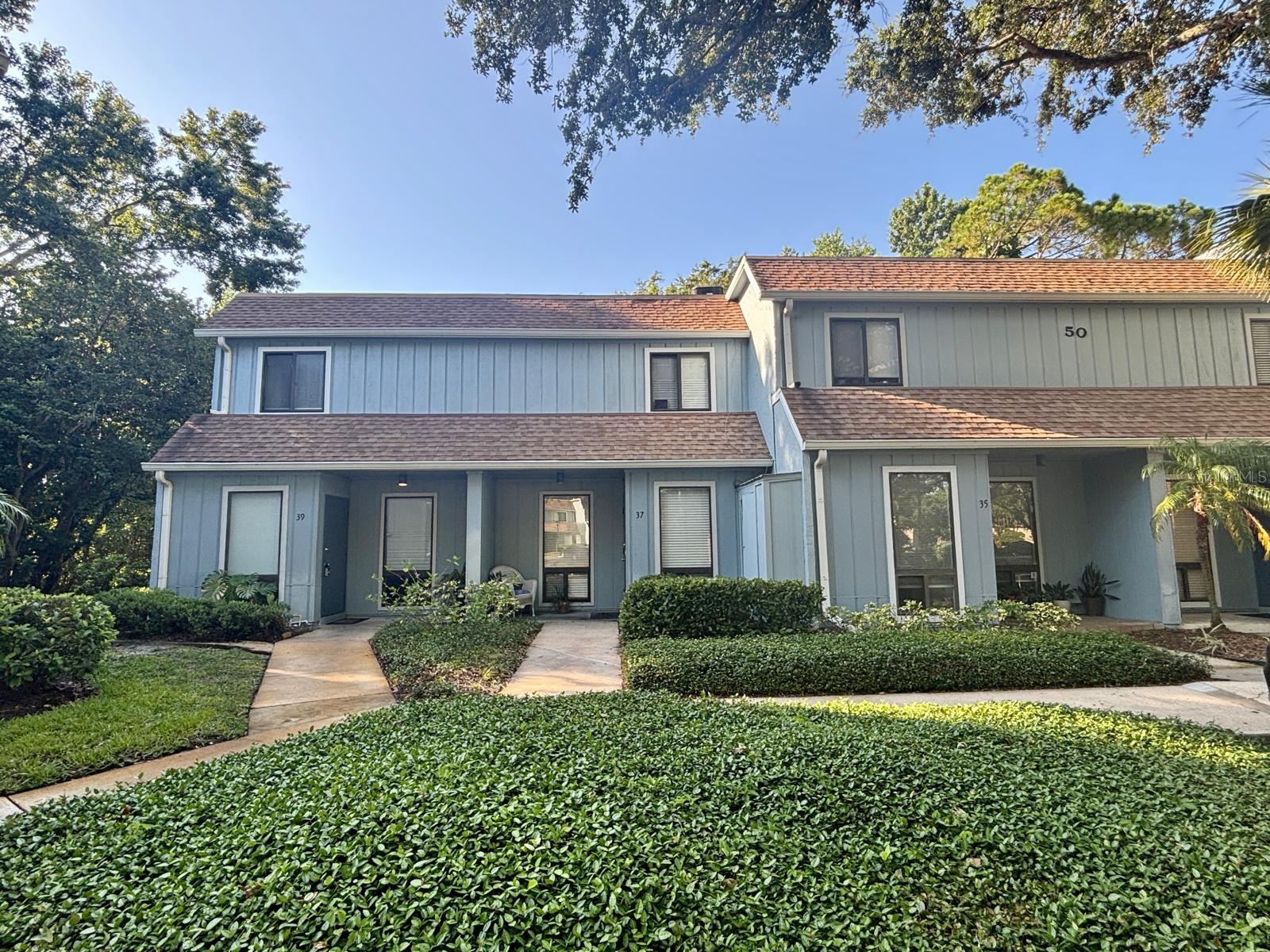 Dreams Do Come True!! Live your best life in this rarely available end-unit condo located in the vibrant, nature-rich Highlands—one of Central Florida’s most sought-after recreational communities! This freshly painted 2-bedroom, 1.5-bathroom two-story home offers comfort, style, and convenience, featuring tile floors throughout, ceiling fans in every room, and in-unit laundry. Both bedrooms are privately located upstairs, while the screened-in patio offers a peaceful outdoor retreat with added privacy. You’ll love the assigned parking spot right outside your door and plenty of visitor parking for guests. The Highlands lifestyle is truly unmatched, offering resort-style amenities including a sparkling pool, tennis courts, scenic nature trails, and tranquil creekside walking paths surrounded by mature landscaping. Located just a short walk to Highlands Elementary and minutes from the Seminole County Environmental Center, UCF, Seminole State College, top-rated schools, beaches, and downtown Orlando. Whether you're seeking peace, adventure, or a bit of both—this is where nature and convenience come together. Dreams Do Come True... and this one is ready for you!
