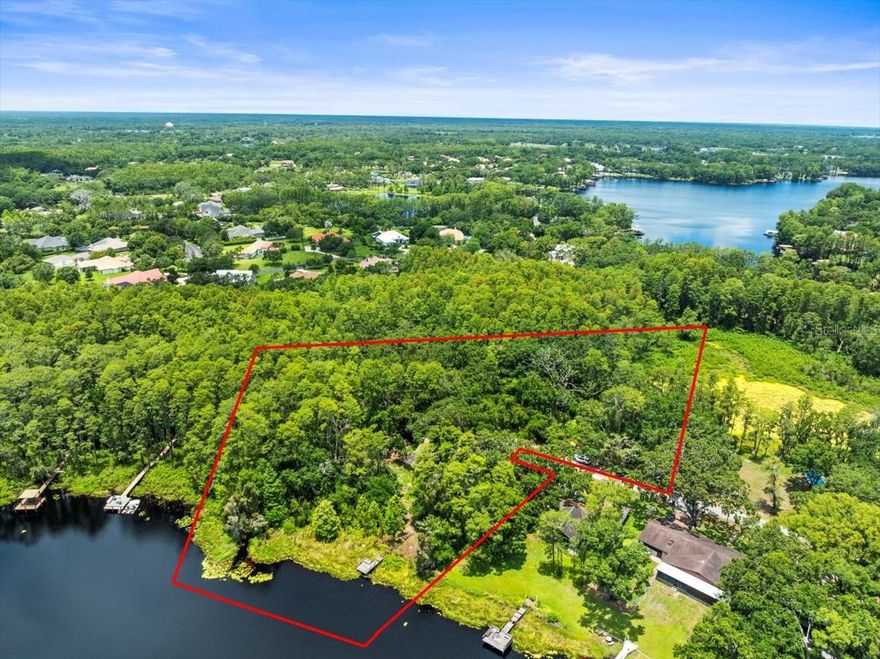 This is truly a beautiful "one-of-a-kind" estate property - one of the most uniquely beautiful properties in all of Odessa. Owned by a wonderful family with a long established history in the Odessa area. Magnificent, huge grandfather oaks plus large, beautiful cypress tress, and beautiful blooming bouganvillea. Breath taking view of park-like setting and ski sized Lake Armistead. This fantastic property is at the very end of a private road and thus enjoys complete privacy. MUST SEE to believe! Listing agent must accompany, please do not go to the property without the listing agent being present. Call today to schedule an appointment to see this unique oasis!