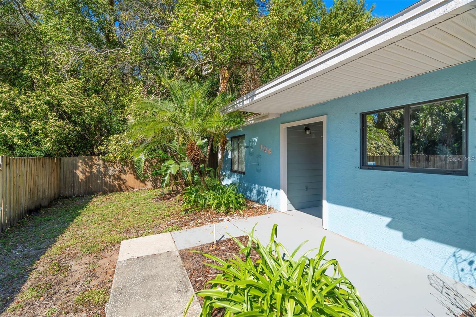 Welcome to this charming two-bedroom, two-bathroom villa in the highly desirable community of Tarpon Springs! Ideally located for boating and water sports enthusiasts, you'll find multiple marinas just a short walk away. This sought-after single-floor attached villa-style home is nestled in a quiet neighborhood and features mature tropical landscaping and a recently painted entry area. Inside, you'll be greeted by soaring ceilings with recessed lighting and a skylight, as well as stylish architecture and desirable wood-like vinyl plank flooring. The home offers an excellent floor plan for casual daily living as well as being spacious enough for entertaining your family and friends. The kitchen is open to the living room and features tasteful-looking cabinets, counters, nice appliances, and great counter space. The primary suite features a beautifully updated bathroom with a large walk-in shower with a seat as well as an updated vanity. Accessible from both the living room and the primary bedroom, you'll certainly enjoy time spent in the large screened-in lanai, which is sure to be your go-to spot for taking advantage of the great Florida weather. The private and fully fenced backyard is just the right size for a dog, a garden, or simply low-maintenance living. The private storage shed in your own yard is a perfect bonus space for bikes or kayaks. The convenience of an in-unit washer and dryer adds to the home's appeal. Rest easy knowing this home sustained no damage from recent hurricanes and is located in a non-flood zone. The location is just minutes from historic downtown Tarpon Springs and the famous Sponge Docks!