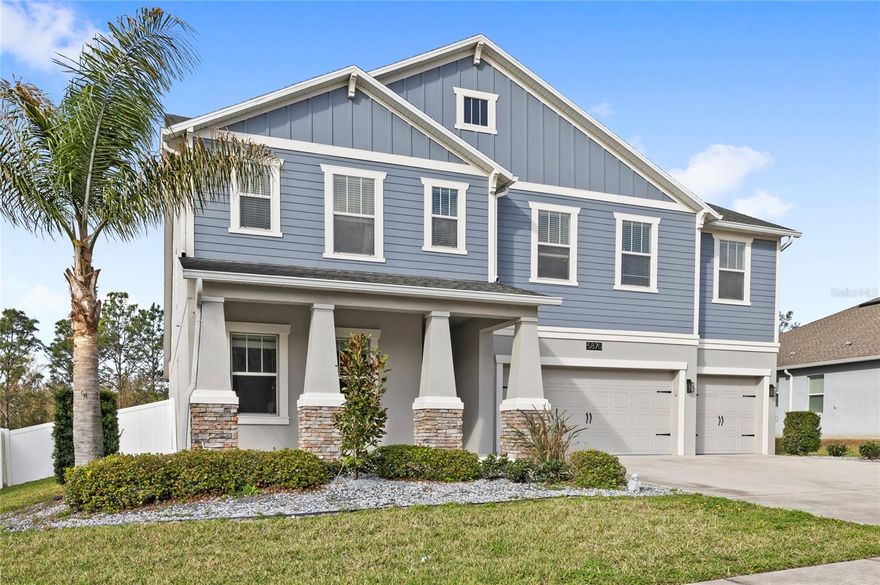 Located in the amenity rich, guard gated community of Stoneybrook Hills in Mount Dora, this spacious 5-bedroom, 4-bathroom home offers nearly 4,000 square feet of living space, a 3-car garage, bonus room, and a private conservation view homesite. Built in 2017, the home features an open floor plan and a first-floor primary suite and first-floor guest suite.
Inside, the main living areas showcase wood-look plank tile flooring, crown molding, and abundant natural light. The open-concept layout centers around the upgraded kitchen, featuring 42-inch wood cabinetry, granite countertops, a subway tile backsplash, stainless steel appliances, a large center island, and an oversized walk-in pantry. A convenient pass through connects the kitchen to the formal dining room, adding additional storage and functionality. The kitchen opens into the spacious family room highlighted by a fireplace with custom built-ins. The first-floor primary suite offers conservation views and private access to the screened lanai. The suite features a large custom walk-in closet with direct access to the laundry room. The primary en-suite includes dual vanities, a soaking tub, and a large shower. Upstairs, a large bonus room provides flexible secondary living space. Two bedrooms share a Jack-and-Jill bathroom, while the fifth bedroom includes a built-in Murphy bed and private full bathroom.
Outdoor living is designed to take full advantage of the oversized fenced conservation lot. The screened paver lanai overlooks the backyard, which offers an additional custom paver patio, sun deck, and fire pit area.
Additional features include dual A/C systems, a 50-amp RV outlet, and a 3-car garage with overhead storage. Residents of Stoneybrook Hills enjoy resort-style amenities including a clubhouse, fitness center, resort pool, splash pad, tennis courts, basketball courts, baseball field, and playground. The home is conveniently located just minutes from grocery shopping, major highways including the 429 and Wekiva Parkway, and downtown Mount Dora. Call today to schedule a private tour.