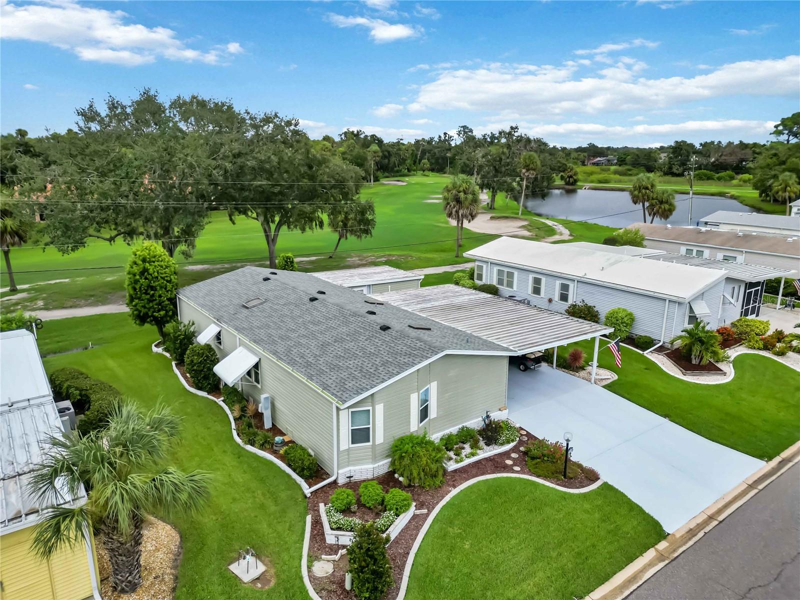 The one you've been waiting for! This beautifully maintained 2-bedroom, 2-bathroom property has everything you’re looking for—plus a few surprises you’ll love. Sitting on a private lot that backs up to the 13th fairway, it’s the perfect spot for enjoying peaceful views and a little extra privacy.
Inside, you'll notice details that set a Jacobsen model apart from the others as you’ll find an abundance of thoughtful upgrades. You'll find impact windows in the living room, newer plexiglass windows in the enclosed, under air flex room, and the rest of the windows are updated double-pane windows. Touches like crown molding throughout provides an elegant and finished feel. A new roof and skylights installed in 2021 ensure peace of mind for years to come. The interior is enhanced by vinyl and laminate flooring—no carpet anywhere, plus walk-in closets in both bedrooms and ample built-in storage throughout the home to keep everything organized. Off the spacious dining room and kitchen is a quaint bar with built in cabinetry and bar fridge. The primary bedroom is equipped with a beautiful and updated en suite with the convenience of inside laundry---no sweating folding clothes out in the garage!
Even better, there’s an extra 240 square feet of insulated living space with dual-zone AC, ideal for a home office, craft room, or just an extra place to relax. Step outside to enjoy a convenient storage shed, covered parking, and beautiful landscaping that completes the property’s curb appeal. As part of the vibrant community of Imperial Lakes Estates, you’ll have access to fantastic amenities including shuffleboard, pickleball, a pool and spa, clubhouse, and billiard room—plenty of options for recreation and socializing with always something fun to do right outside your front door.