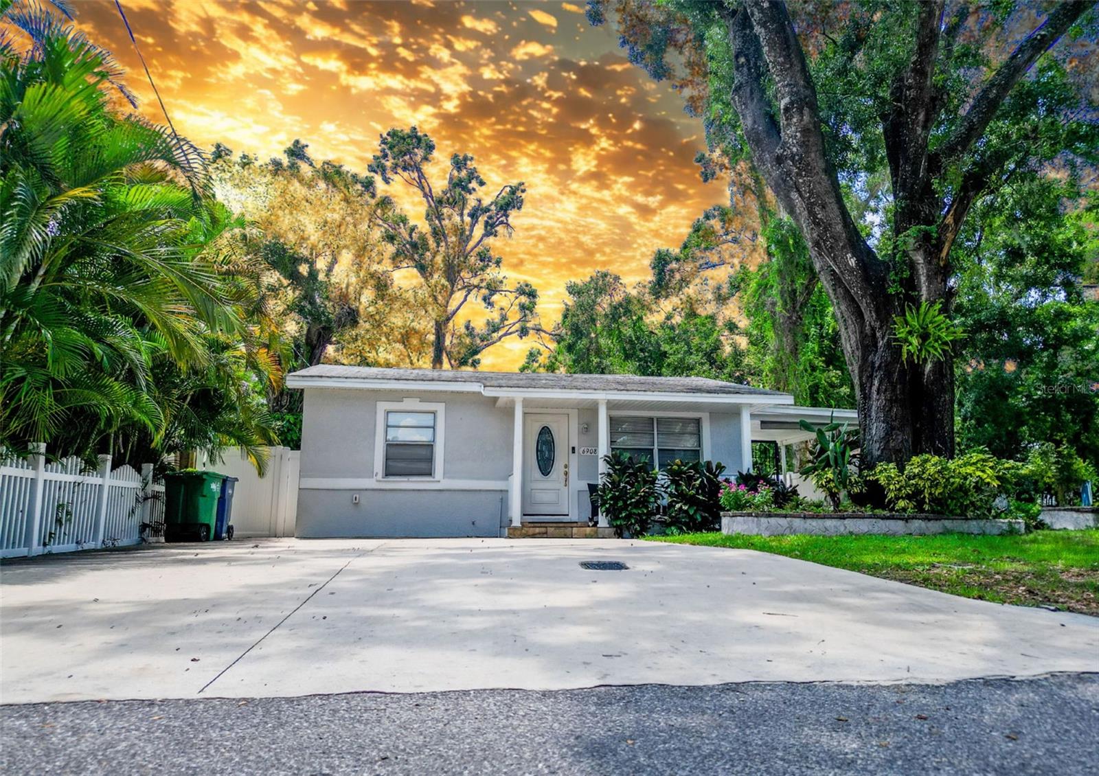 Nestled in the heart of Tampa, this stunning ranch-style home offers the perfect blend of Florida charm and comfort. The single-story layout spans over 1,500 square feet, featuring 3 bedrooms and 2.5 bathrooms, with no HOA on a generously proportioned lot. The spacious master bedroom features a walk-in closet and an en-suite bathroom with a double vanity and a spa-like shower; two additional bedrooms share a well-appointed bathroom. Outside, the fenced-in backyard awaits, a private retreat ideal for pursuing outdoor hobbies or simply enjoying some sunshine in peace. The versatile enclosed outdoor space and patio add to the allure, providing a serene space for outdoor dining and an excellent opportunity for potential expansion and entertaining which could easily be converted to create additional living space, a guest suite, or a home office with a convenient outdoor half bathroom, sink with cabinets ensuring guests don't need to enter the main house. The extensive parking options make this home ideal for owners with multiple vehicles, recreational vehicles such as RVs, Boats or Jet ski's and extra guest parking. The HVAC, water heater, and fence were replaced in 2023. No Flood insurance! Conveniently located 1 minute from the Tampa Zoo and 11 minutes from Downtown Tampa.