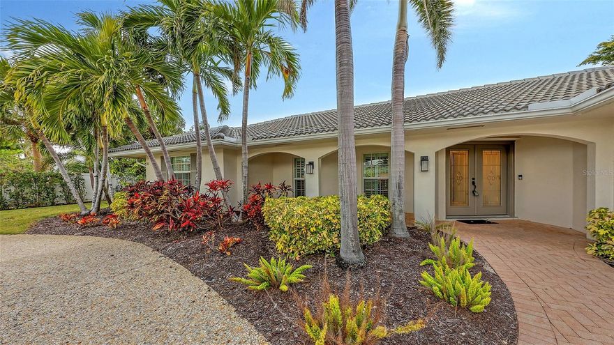 This lovely Bird Key garden home resides on a corner lot with a large circular paver driveway and beautiful landscaping that leads to the front door with the 2 car garage located on the side of the house. Inside, you will find abundant natural light with many windows and glass sliders that afford a splendid view of the large yard and pool area with a private garden wall. This three-bedroom residence has a split floor plan offering a private master suite, complete with 2 walk-in closets, an en-suite bathroom, and sliding doors to the pool deck. The two guest bedrooms and a second bathroom complete the other end of the house. A powder room and an oversized laundry room with a sink and loads of storage are a bonus not found in many garden homes. The kitchen overlooks the large backyard and pool area, with granite countertops, stainless steel appliances, and a breakfast bar overlooking the family/dining room. The house has high-impact windows & sliding doors, a heated pool, a well for irrigation, and mature lush landscaping that provide privacy and a large fenced back yard. The most recent upgrades and improvements from the interior to the exterior include re-ling the plumbing under the slab. The garage was gutted, painted and the floor epoxied. Updated interior baseboards and stunning interior lighting were installed throughout the home, giving it an updated, sleek look. This home is move-in ready. Live the comfortable Florida dream by opening large sliders to the pool area, with neutral tile throughout and a spacious flowing floorplan that makes the indoor-outdoor lifestyle easy. This residential island has its own optional Bird Key Yacht Club, tennis courts, swimming pool, fitness room, social scene, boat slips, marina, indoor and outdoor dining. These are the perfect ingredients for making this your private island retreat, complete with nearby beaches, dining, shopping, excellent schools, and the beautiful downtown area.