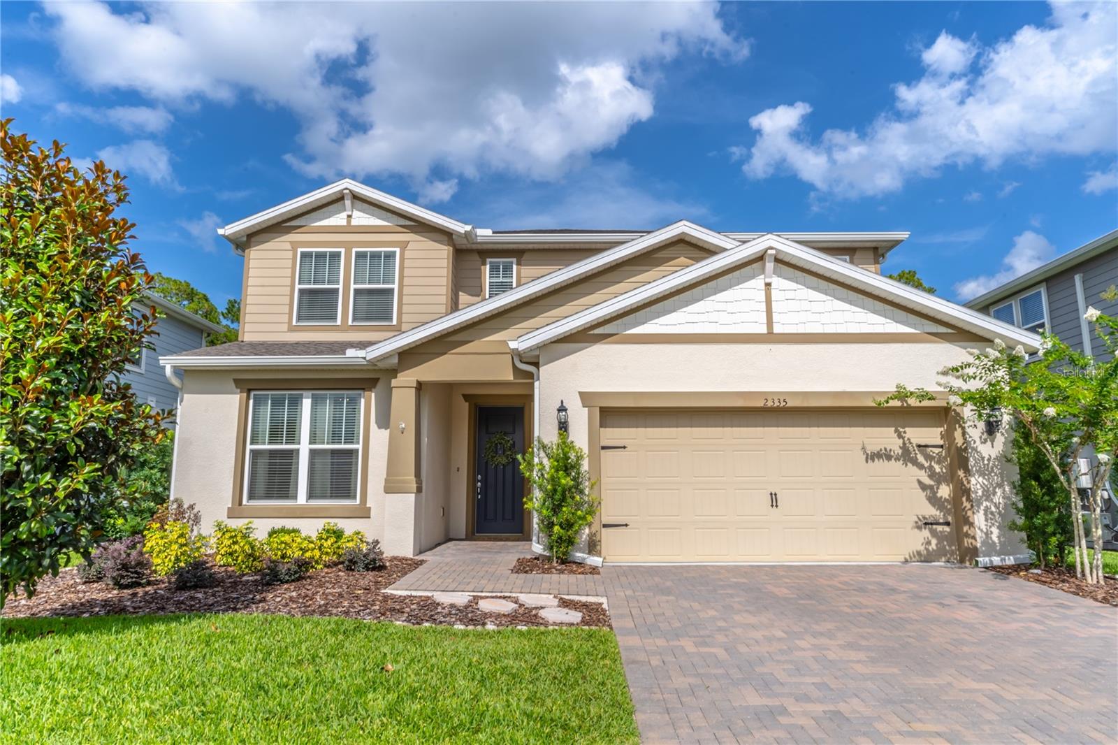 This gorgeous 5-bedroom home in the adorable Chapman Pines neighborhood provides ample space with beautiful finishes. As you enter the home you are greeted by wonderful natural light and cool neutral tones. A great room provides wonderful space for entertaining family and friends. The great room has glass sliders that open to a pavered, covered patio. The large kitchen with a dining area overlooks the family room. The open kitchen boasts granite counters, gas cooktop, stainless-steel appliances, closet pantry, breakfast bar & pendant lights. The dining area is directly off the kitchen and provides glass sliders to the pavered and covered patio. A guest bedroom also graces the 1st floor with an ensuite bathroom. The staircase features beautiful wooden half door at both the top and bottom of the stairs to help keep children and fur babies safe. The primary bedroom is on the 2nd floor with an ensuite bathroom and walk-in closet. An additional 3 bedrooms are on the second floor and share a hallway bathroom. The upstairs also showcases a large bonus room that provides the perfect flex space with endless opportunities. The fenced backyard includes a covered, pavered patio with ceiling fan and lush green space. Additional features are a tankless gas water heater, plumbing for natural gas hook up near the patio and 2 A/C units. Chapman Pines is a natural gas neighborhood and the Chapman Pines HOA includes water for yard irrigation.