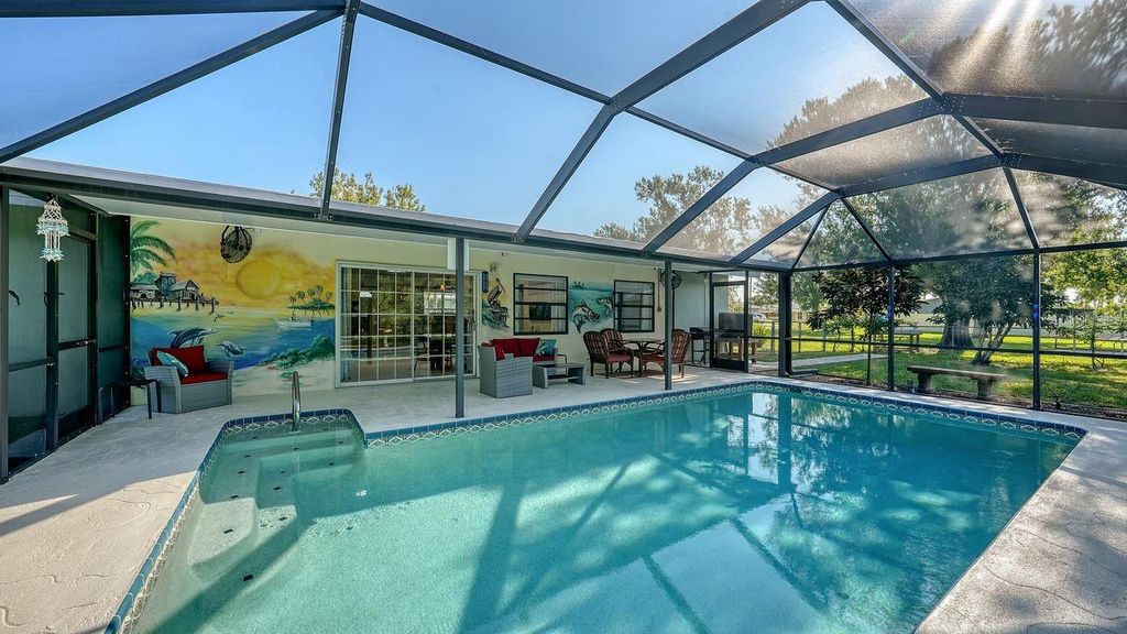 Photo of 18753 Macgill Avenue, Port Charlotte, FL 33948 (MLS # C7512947)