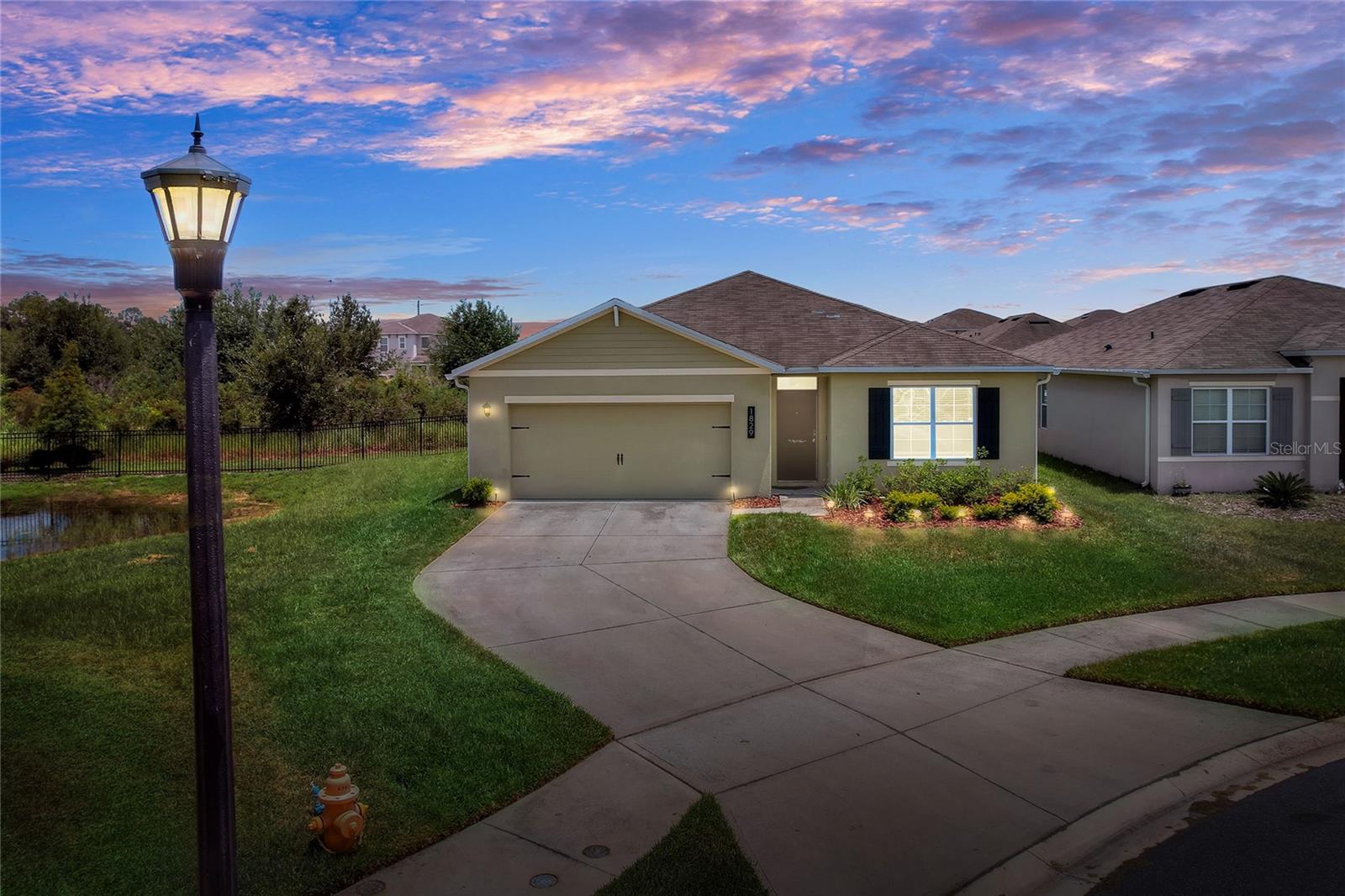 One or more photo(s) has been virtually staged. Modern 4-Bedroom Home with Designer Upgrades in a Resort-Style Gated Community
Welcome to 1829 Pristine Loop – a beautifully upgraded 4-bedroom, 2-bath single-family home located in one of Lakeland’s most desirable communities. With 1,867 sq ft of open-concept living space, this home offers the perfect blend of comfort, style, and function.
Step inside to discover elegant archways, durable tile flooring, and warm wood-toned floors in the bedrooms. The living and dining areas are highlighted by charming shiplap accent walls, while the kitchen shines with granite countertops, updated hardware, a custom walk-in pantry, and a large island that’s perfect for entertaining.
The spacious primary suite offers a peaceful retreat, complete with backyard views, a walk-in closet, and a spa-inspired bathroom featuring a step-in shower, modern mirrors, and custom shiplap detailing.
Enjoy indoor-outdoor living with a screened lanai, a stylish pergola, and a beautifully maintained, fully fenced backyard—ideal for relaxing or entertaining. Additional perks include a two-car garage with sleek epoxy flooring and a generously sized walk-in laundry room.
Community amenities include:
Resort-style zero-entry pool,
Playground,
Splash pad & shaded cabana,
Fitness center & clubhouse,
Peaceful ponds, fountains & conservation views,
Open green spaces & outdoor seating areas,
Natural landscaping and walking paths.
Located just minutes from top-rated schools, parks, shopping, dining, and major transportation routes, this home truly has it all.
Don’t miss the opportunity to make this stylish and spacious home your own—schedule your private tour today!