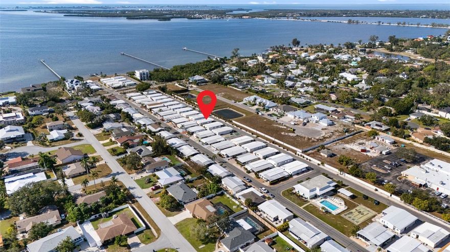 Welcome to Palma Sola Shores, a highly desirable land-owned 55+ community just minutes from Anna Maria Island. This beautifully maintained and fully turn-key 2-bedroom, 2-bath home has been thoughtfully and extensively updated, offering modern comfort and true peace of mind. Inside, you’ll find an inviting and light-filled interior with new flooring, lighting, and fans throughout, all completed in 2019. Both bathrooms were fully renovated the same year with updated electrical, plumbing, lighting, vents, and new showers, creating a fresh and cohesive feel throughout the home. The kitchen was also completely remodeled in 2019 and features new cabinets, appliances, countertops, sink and disposal, along with updated plumbing, electrical, and under-cabinet lighting—making it both beautiful and functional.
The spacious sun room serves as an ideal bonus living area and was upgraded with new windows and door, insulated ceiling panels, and new flooring in 2019, along with a new window A/C unit installed in 2025. The primary living spaces are furnished with quality pieces, including an adjustable bed in the primary bedroom and a Tempur-Pedic sleeper sofa in the living room, allowing this home to be enjoyed immediately upon arrival. Additional improvements include a new roof installed in 2022 with a 20-year warranty, a new vapor barrier underneath in 2024, a hot water heater replaced in 2021, and an A/C upgrade in 2019 to cool the sun room more efficiently. The home was termite-tented in October 2025 and comes with a transferable 10-year warranty, providing reassurance for years to come. The driveway was resurfaced with polyaspartic decorative chip coating in 2022, and the property also features decorative curbing added in 2021, a new Maytag washer and dryer installed in the shed in 2025, and a new outdoor shower added in 2024. Palma Sola Shores offers a welcoming coastal lifestyle with access to a heated pool, clubhouse, waterfront dock, and kayak launch, all for an incredibly low HOA fee of just $300 per month. Conveniently located near beaches, Robinson Preserve, grocery stores, restaurants, medical facilities, and SRQ airport, this home offers the perfect blend of comfort, updates, and location. Move right in and enjoy everything this beautifully renovated home and charming community have to offer.