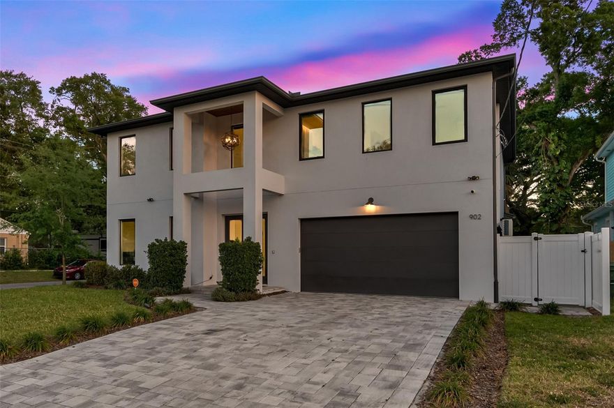 Designed with modern living in mind, this spacious home features 4 bedrooms, 3 bathrooms and 3,277 SqFt of open concept living. The double height ceilings, engineered hardwood flooring and impact rated windows create a bright and welcoming atmosphere throughout. The kitchen includes premium appliances, quartz countertops, a large island, wine cooler, drawer microwave and sleek lighting. The primary suite offers a double shower, freestanding tub and dual vanities.

The outdoor area is ideal for relaxing or entertaining with a heated pool and hot tub controlled by a Pentair smart system. The converted garage provides a gym setup, EV charger and a game room area. Additional features include motorized blinds, a Vivint home security system and televisions in every room. The home is fully furnished and move in ready, and can also be rented unfurnished if preferred.

Located minutes from Downtown Tampa, Armature Works, the Riverwalk and quick access to I 275, this home offers modern comfort in a highly convenient Tampa location.