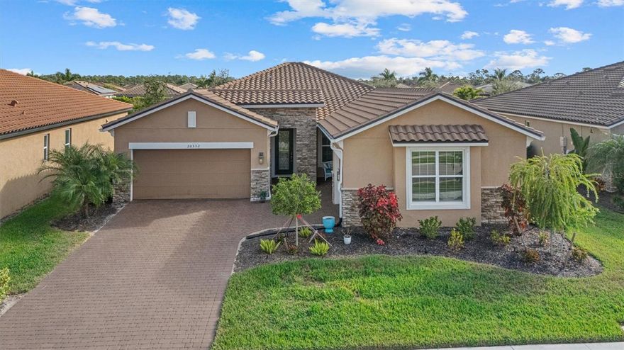 This highly upgraded Nantucket II model in Renaissance at Wellen Park offers four bedrooms, three baths, and a three-car garage with a rare multigenerational layout, ideal for a private in-law or guest suite with separate entrance and garage access. Located outside a flood zone, no flood insurance is required.
The redesigned kitchen features custom 50-inch maple cabinetry, quartz countertops, an oversized island, and premium appliances including KitchenAid wall oven/microwave, Samsung FlexZone refrigerator (2022), LG dishwasher, Whirlpool cooktop, and vented stainless hood. Wood-look tile flooring flows through the main living areas, complemented by tray ceilings with crown molding and upscale finishes throughout.
Enjoy an extended screened lanai pre-plumbed for an outdoor kitchen, surrounded by tropical landscaping, with room to add a custom pool. Additional upgrades include $25K in storm protection (accordion shutters, automatic lanai screen, 2023 impact-glass front door), upgraded laundry cabinetry, and a Sentricon termite system.
Renaissance at Wellen Park offers resort-style amenities including clubhouse, pickleball, tennis, bocce, playground, Blue Heron Park access, and proximity to downtown Wellen Park, CoolToday Park, golf, shopping, and Gulf beaches.