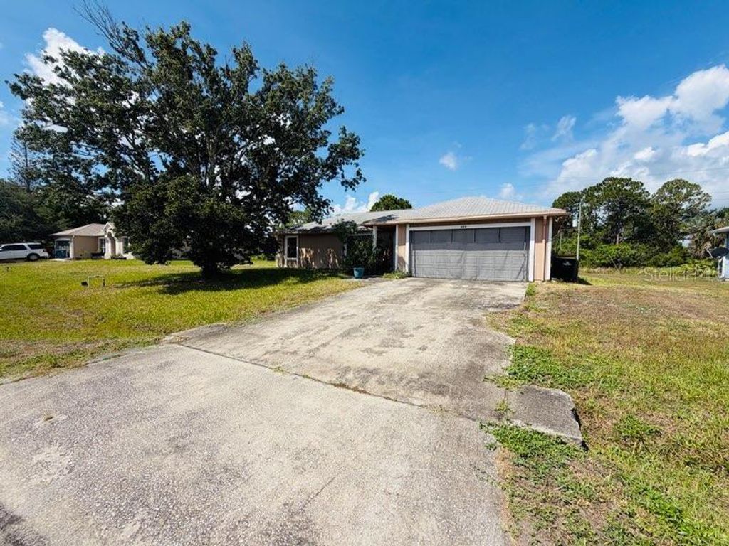 Photo of 450 Topeka Rd, Palm Bay, FL 32908 (MLS # O6417109)