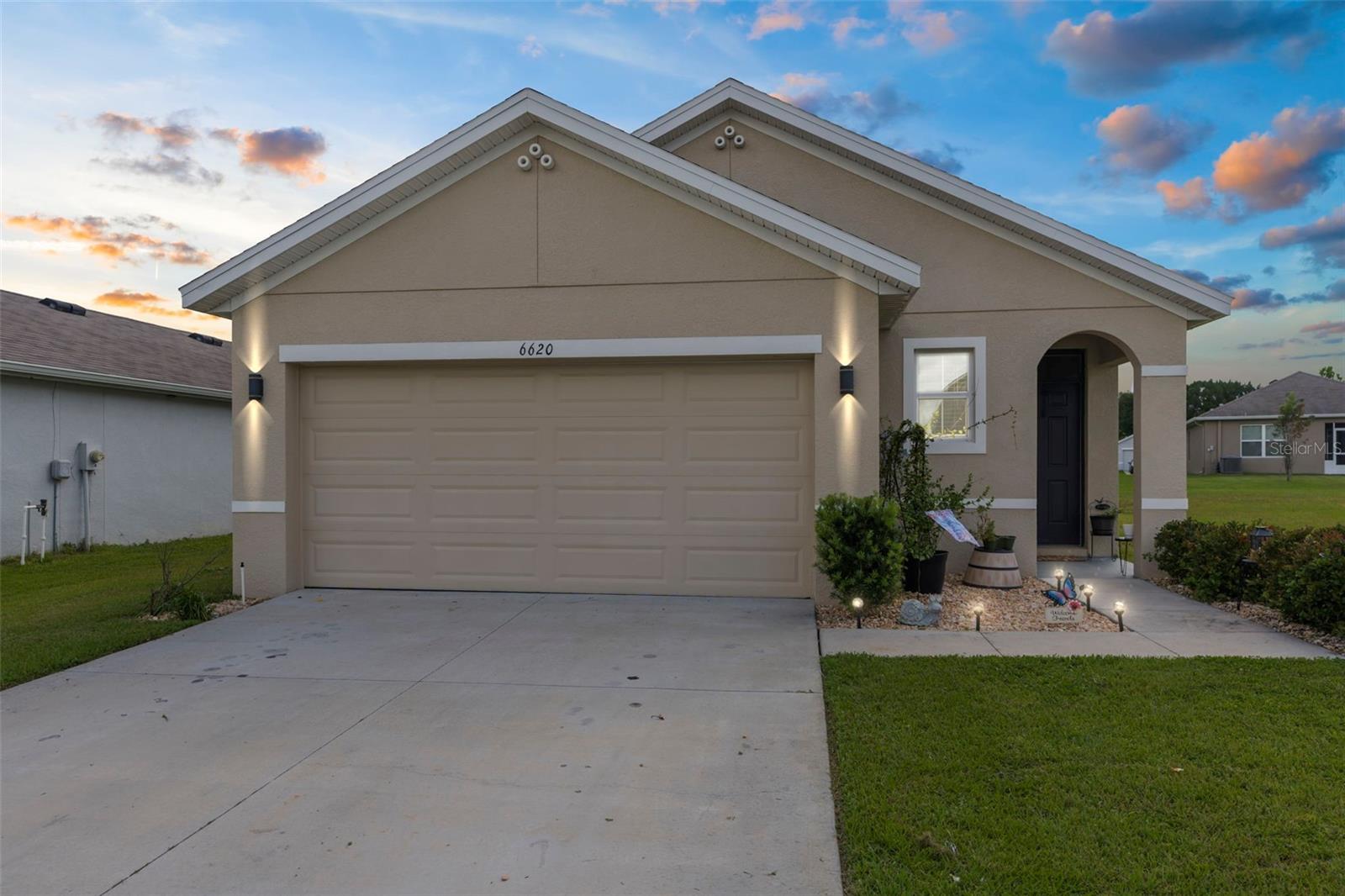 Beautiful 3 Bed / 2 Bath / 2-Car Garage Home in Gated Brooksville Community - Built in 2020 with LOW monthly HOA! Welcome to this charming and move-in-ready 3-bedroom, 2-bathroom home with over 1,500 sq ft of living space, nestled in one of Brooksville's most adorable gated communities! Built in 2020, this home offers modern features, fresh updates, and is located on the best lot in the neighborhood! Inside, enjoy new flooring, fresh interior paint, and an open-concept layout that feels both spacious and inviting. The kitchen comes fully equipped with all major appliances including refrigerator, microwave, range, dishwasher, disposal, washer, and dryer — making move-in a breeze. The primary suite is generously sized, complete with an extra-large walk-in closet, dual vanity sinks, and a large walk-in shower. A smart thermostat and home security hub are already in place, ready for your system install. Step outside to your large, partially fenced backyard, with over half an acre of flat, grassy common area adjacent, it makes this homes yard feel MUCH bigger, and the best part, you don't have to maintain that portion! This lot is truly one-of-a-kind in the community! Additional highlights include: Not located in a flood zone; 90/month HOA; Brand new community gate for added peace of mind; Mailbox located right next door; Sewer and county water; Just 5 minutes to Brooksville shopping and 10 minutes to major amenities and attractions This home is priced to sell and offers the perfect combination of space, comfort, and location. So schedule your showing today!