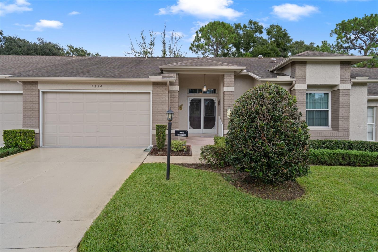 Welcome to this expanded Oakmont Villa offering great potential and ready for your personal touch! This spacious 2-bedroom, 2-bath home with a 2-car garage features cathedral ceilings in the main living areas, creating an open and airy feel throughout. The home’s solid structure includes a roof replaced in 2012 and HVAC system updated in 2010, giving you a strong foundation to build upon. Whether you're looking to customize your dream retirement retreat or invest in a home with great bones, this villa is a fantastic opportunity. Don’t miss your chance to make it your own! Timber Pines is an award winning, 55+ Active Adult Gated Community with 4 golf courses, 2 pools & hot tubs, Country Club, restaurant and lounge, Performing Arts Center, 2 Pro Shops, 12 newer, state-of-the-art Pickle Ball Courts, Tennis, 2 Dog Parks, and a State-of-the-Art Wellness Center & Fitness Center & over 100 clubs, and activities. A one time, $2,900 Buyer’s Capital Contribution, is due at closing. Not a Dog friendly village. Can be sold furnished or unfirnished at Buyer's option. Seller request a late October 2025 closing.