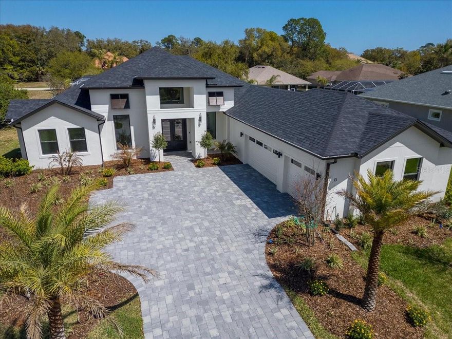 Simply elevated in design and highlighted by soaring 12-16 ft ceilings, this luxury NEW CONSTRUCTION HOME on an expansive lot showcases exceptional craftsmanship, sophisticated finishes, and a seamless blend of elegance and comfort. At the center of the home is a stunning gourmet kitchen showcasing style and function. The private butler's pantry adds additional workspace and storage. A luxurious owner's suite offers a spa-inspired bathroom and spacious dual closets. Two multi-panel sliding glass doors seamlessly connect the interior living spaces to two grand lanais with an outdoor kitchen, creating the perfect setting for indoor-outdoor living year round. Enjoy a private study with French doors offering a quiet retreat. Even the laundry room is thoughtfully designed with cabinetry, utility sink, and generous counter space, blending everyday function with elevated style.

Three additional bedrooms include one with a private ensuite bath, while the remaining two bedrooms share a well-appointed full bath. There is also a powder half bath conveniently located for guests. This stunning home features concrete block construction, energy-efficient windows, whole-home gutters, full irrigation, 3-car garage with epoxy flooring, and paver driveway. Designed to impress at every turn, this remarkable residence combines architectural elegance, high-end finishes, and resort-inspired outdoor living to create a truly elevated lifestyle experience. An extraordinary home designed for refined living and ready to welcome you home.

Discover the hidden gem of Palm Coast in The Sanctuary, a private, gated boating community offering the perfect blend of tranquility, luxury, and Florida charm. Tucked away along the Intracoastal Waterway, this exclusive enclave featuring 175 homes, invites you to live each day like a vacation. Whether you're dreaming of expansive waterfront views or a lush, oak-shaded setting, this vibrant community offers something for everyone. More than just a neighborhood, The Sanctuary is a way of life. Spend your days sailing the Intracoastal, soaking in the sunshine, or exploring the surrounding natural landscape, all within the comfort of a secure, beautifully maintained community. The Sanctuary features pristine lakes and trails that wind through majestic old oak trees. Leaving The Sanctuary, you have easy access to an abundance of shopping and activities, most notably beautiful Atlantic beaches and several golf courses. From Palm Coast, you only need to travel a few miles on I-95 to explore northeastern Florida including Jacksonville, St. Augustine, Ormond, Orlando, and Daytona Beach, as well as many parks and attractions.