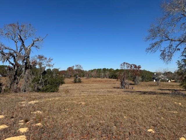 This 2.96-acre parcel is located in a stunning gated community, providing both privacy and security for its residents. Set amidst the tranquil beauty of Citrus County, this property offers a unique chance to experience the pinnacle of luxurious living. The gated community enhances security while fostering a close-knit atmosphere among neighbors, all centered around a picturesque lake with a walking path. This is your opportunity to build your dream home and embrace a lifestyle of elegance and harmony with nature.