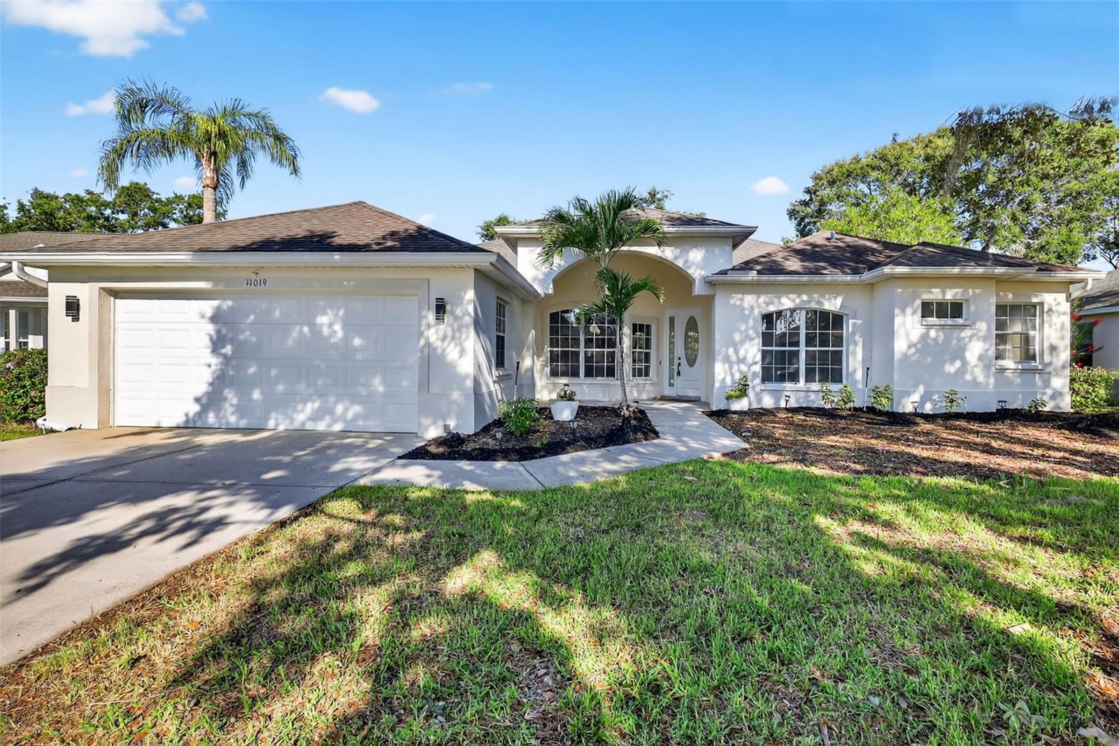 Beautifully renovated 4-bedroom, 3-bathroom pool home located in the highly sought-after community of Summerfield Village in Lakewood Ranch. This spacious and elegant residence offers 2,317 heated square feet and 3,175 total square feet, all situated on a generous 0.26-acre lot with lush landscaping, palm trees, and a well-maintained front garden that enhances the home's curb appeal. Step inside to discover brand new luxury vinyl plank flooring throughout the living areas and a bright, open layout designed for modern living. The fully updated kitchen is both stylish and functional, featuring brand new stainless steel appliances, quartz countertops, ample cabinetry, and a layout that flows seamlessly into the living and dining spaces. Each bedroom is thoughtfully designed with large windows that allow for an abundance of natural light, creating a warm and inviting atmosphere. The primary suite is a true retreat, offering a spacious layout, large closets, and a luxurious en-suite bathroom complete with a tiled walk-in shower and a separate sit-in soaking tub. The living area opens to a sliding glass door that leads out to a screened-in pool patio, ideal for relaxing or entertaining guests. The expansive backyard provides plenty of room for outdoor gatherings, play, or simply enjoying peaceful Florida evenings. Additional features include a 2-car garage, updated lighting and fixtures throughout, and a location that offers easy access to top-rated schools, parks, shopping, dining, and all the amenities that Lakewood Ranch is known for. This move-in-ready home is a rare opportunity to own a completely renovated property in one of the area’s most established and desirable neighborhoods.