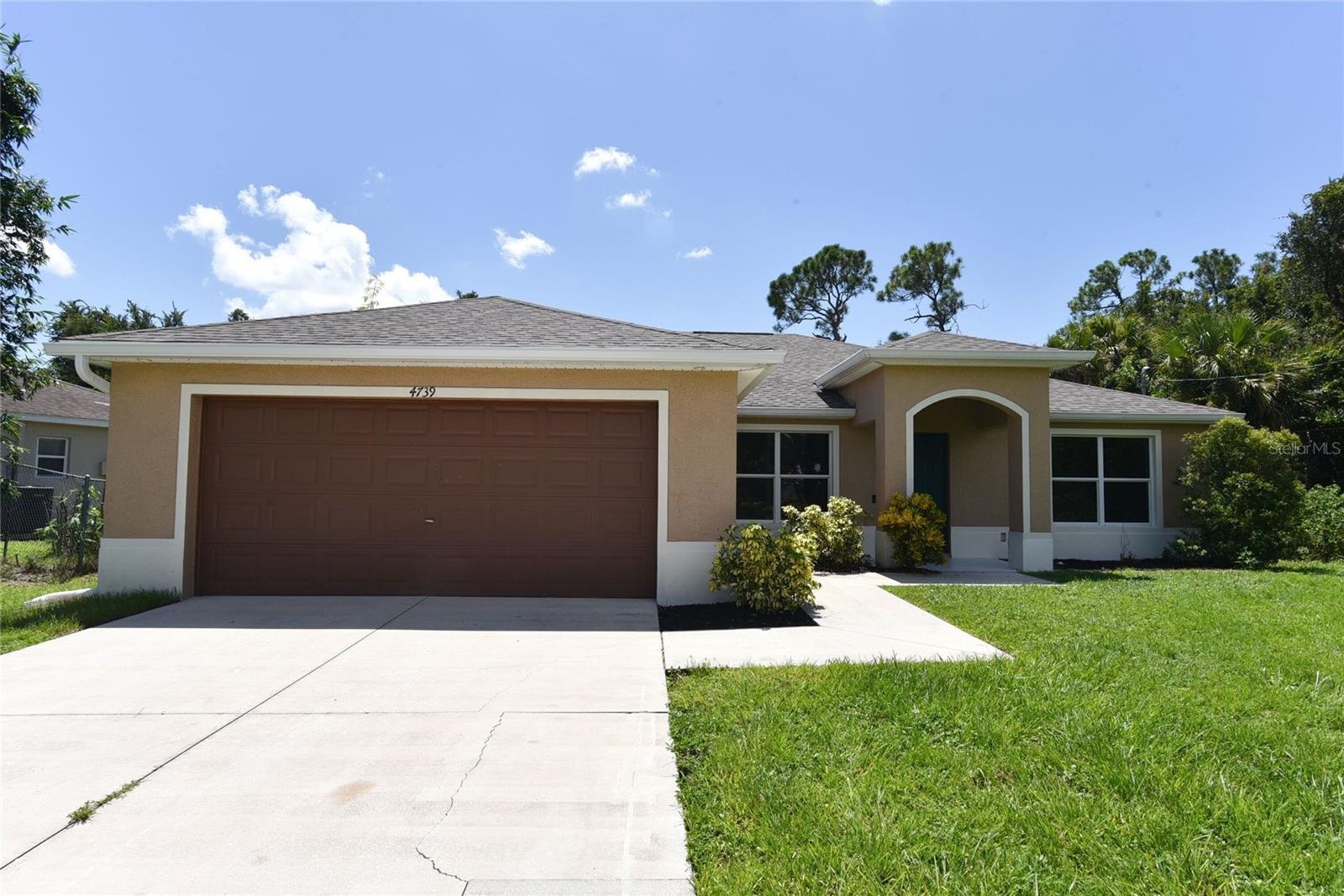 Welcome home to this nicely updated 3-bedroom, 2-bathroom home, perfectly situated on a spacious lot in a serene, well-established North Port neighborhood. Spanning almost 1,900 sq/ft., this home features a thoughtfully designed layout with abundant natural light, enhanced by brand-new LVT flooring throughout for a seamless blend of style and durability. A front study/office provides a versatile space for work or relaxation, ideal for today’s dynamic lifestyle. The heart of the home is a modern kitchen, now boasting brand-new stainless-steel appliances. the large great room provides plenty of space to spread out while the primary bedroom boasts two walking closets while the ensuite bathroom features a step in shower and well as two sink vanity. Two additional bedrooms are split from the primary and offer plenty of privacy as well as a shared second bathroom with tub/shower combo. Step outside to a large screened and shaded lanai, perfect for entertaining or unwinding while surrounded by a picturesque, tree-lined lot. Built for peace of mind, this home also features a newer roof, ensuring durability and safety in any weather. Nestled close to top-rated schools, shopping, hospitals, and pristine beaches, this home combines comfort, convenience, and charm. With a bonus room adding extra flexibility, this move-in-ready gem is the perfect place to create lasting memories. Don’t miss your chance to own this exceptional retreat!