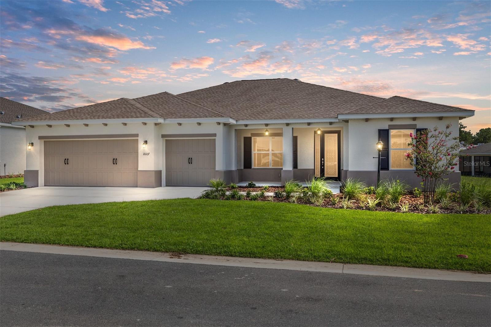 Step into effortless elegance with this brand-new Beatrix model, located in the heart of Ocala’s most sought-after gated 55+ community-On Top of the World. Designed for both comfort and style, this 2-bedroom, 2-bathroom home features a spacious open-concept layout, upscale finishes, and a versatile flex room with French doors—perfect for a home office, den, or creative space. The chef-inspired kitchen is a true centerpiece, showcasing quartz countertops, a generous center island, stainless steel appliances, and sleek cabinetry with under-cabinet lighting. Whether you're hosting guests or enjoying a quiet evening in, the sunlit dining area flows effortlessly to a screened lanai, offering tranquil views of the property. The luxurious primary suite is your personal retreat, complete with a walk-in closet with direct access to the laundry room, and a spa-like ensuite bathroom featuring his-and-her style vanities with high-end quartz finishes and a beautifully tiled walk-in shower with a glass door. A thoughtfully designed guest wing offers privacy and comfort for visiting friends or family. This home also includes a spacious 2-car garage with an attached golf cart garage—perfect for exploring the community or quick trips to nearby shopping and amenities. Enjoy access to resort-style amenities, golf cart-friendly pathways, and the vibrant, active lifestyle that defines On Top of the World. Don’t miss your chance—schedule your private tour today! This Beatrix beauty won’t last long!