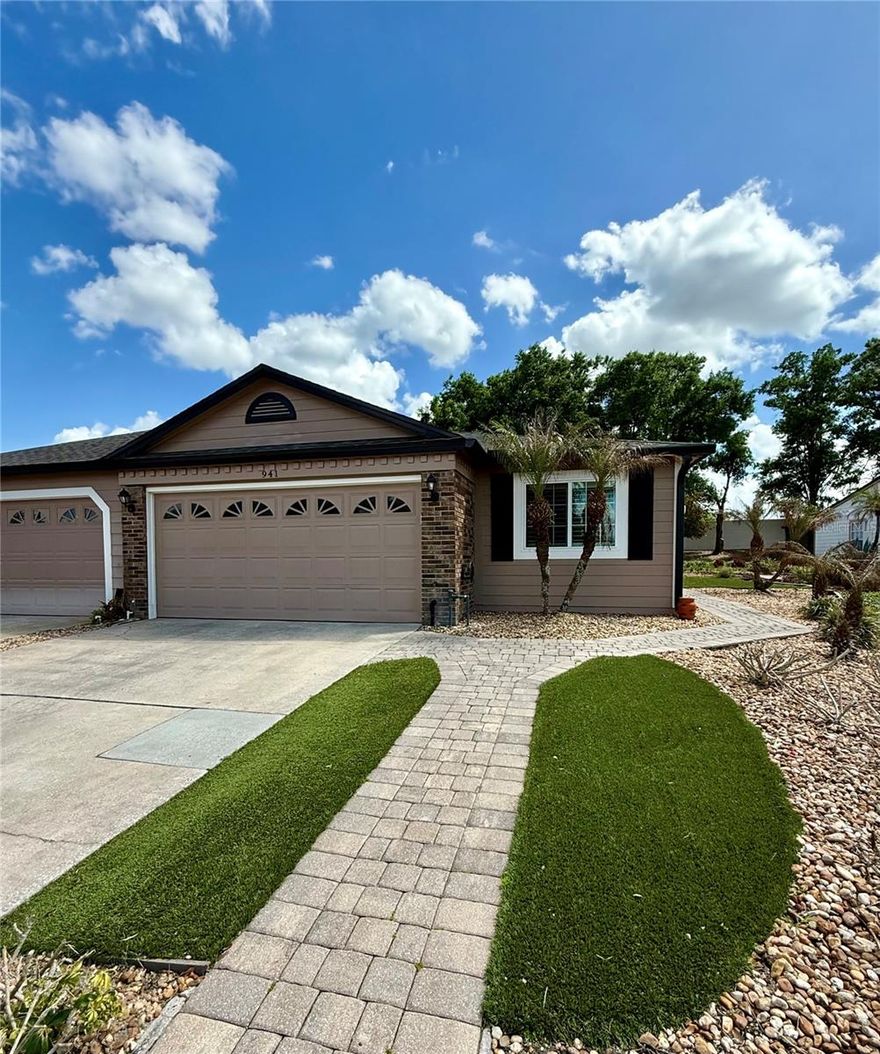 JAW DROPPING GORGEOUS!  Over 2000 square feet of luxury living abounds in this newly updated home.  Owner has spent over $40,000 in the past year to elevate this home to the highest standard.  A brand new HVAC system was installed just months ago. Just a few of the recent upgrades include a professionally painted interior, 7 1/2 inch all wood baseboards, all new lighting and fans plus stunning plantation shutters throughout the home.  The kitchen is out of this world amazing! Including high end solid wood slab custom cabinetry featuring all the bells and whistles like built in accessories throughout, undercabinet lighting, glass lit accent cabinets and the high end professional stainless steel appliances.   Additional features include custom newer double insulated windows and a tankless hot water heater. The rich dark wood floors are in all the living areas as as well as all the bedrooms.  Enjoying the outdoors is a breeze with a huge screened porch plus a beautiful paved lanai looking over a serene treed lined private common area.  This home has a beautiful additional gathering space overlooking the backyard featuring vaulted ceilings.  Low maintenance artificial turf, pavers and rock gardens make yard work a breeze.  SUPER low HOA fees plus a community pool and tennis courts for your enjoyment.  This property is AMAZING!!