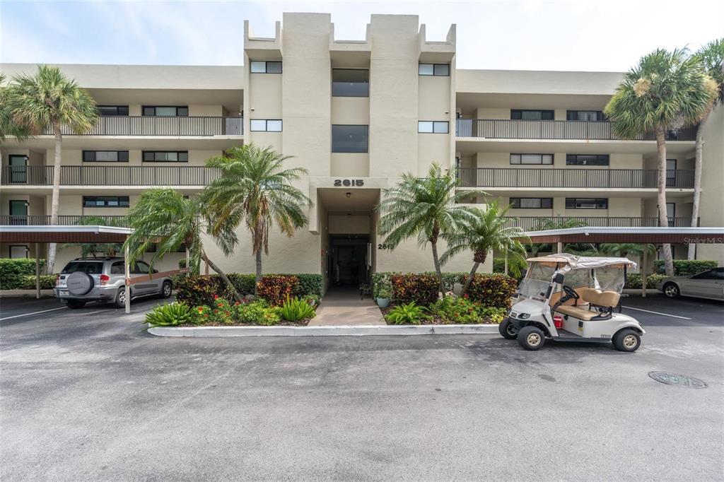 ***Another Price Reduction - Very Motivated Seller!*** Live the Florida waterside and golfing lifestyle in this striking 2 bedroom, 2 bathroom corner unit in beautiful Cove Cay Village I. You will be amazed when you enter this unit and are immediately drawn to the spectacular view of the Cove Cay golf course and the beautiful adjacent pond, frequently visited by various local tropical seabirds. Upgrades galore include a remodeled kitchen (2016) with granite countertops, solid wood cabinetry, stainless steel appliances and porcelain tile flooring. New Hurricane Windows (2020 and 2021) rated for more demanding South Florida specifications keep the home safe, quiet and energy-efficient. The unit boasts a newer AC (2016) and built-in bookshelves. There is one assigned, covered parking spot included with the unit. This unit comes with a separate conveniently located full-size laundry room. The community has a spacious clubhouse that can be reserved for private events, heated pool and spa, fitness center and shuffleboard court surrounded by lush landscaping. There are two gated entrances staffed by 24-hour security. This is a Golf community with a USGA-rated 18 Hole Championship course, PGA Pro at the Clubhouse, the famous Bayview Pub with a FULL menu and Bar for Waterfront Dining, and a marina ready to help you with all your boating needs. Cove Cay has it all! Centrally located off US19 in Clearwater with close access to beaches, shopping, dining and the two local Tampa Bay airports. If you have been looking for your own resort-style condo and dreamed of living a year-round vacation, this is the one for you!