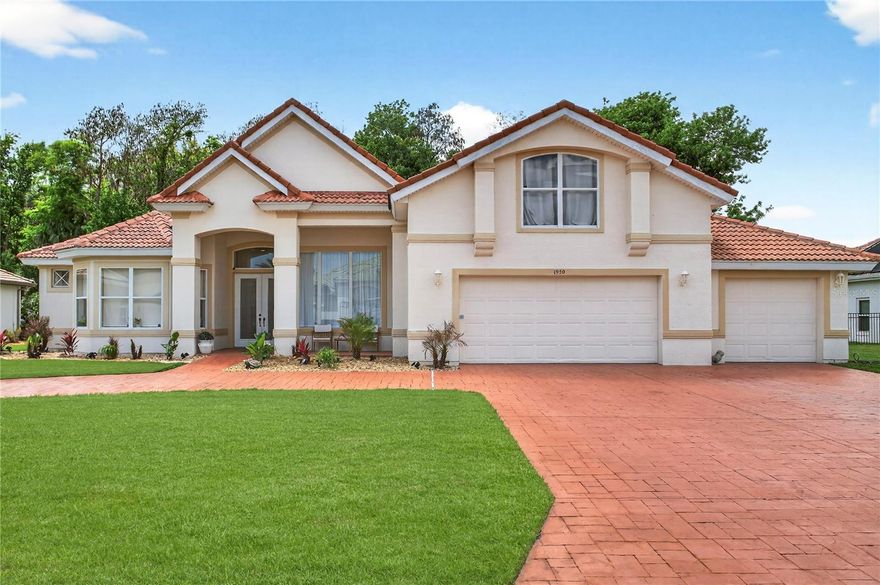 Welcome to your private estate in the prestigious, gated Spruce Creek Fly-In, an exclusive aviation community where refined luxury meets serene sophistication. Perfectly positioned on nearly half an acre within the coveted Reserve Estates, this turnkey pool home offers an exceptional blend of elegance and comfort. Thoughtfully designed with an expansive open-concept layout, the residence showcases soaring ceilings and walls of windows that bathe the interiors in natural light, creating an atmosphere of effortless grandeur.

As you step inside, you are immediately captivated by sweeping views that draw your gaze through the home to the resort-style pool beyond. Framed by lush surroundings, the outdoor setting offers a rare sense of serenity and privacy, with an idyllic backdrop that enhances the home’s tranquil ambiance. Just beyond the fence line, gentle pastureland adds a touch of charm, where neighboring cows occasionally wander over to the fence, offering a delightful, storybook moment as they eagerly greet you for a treat.

Designed with both elegance and privacy in mind, the residence features a true split-bedroom floor plan, creating distinct and peaceful retreats throughout. The primary suite is thoughtfully positioned for ultimate seclusion, offering a luxurious sanctuary complete with two spacious walk-in closets. The spa-inspired bath is beautifully appointed with a wall-to-ceiling tiled walk-in shower and a deep soaking tub—perfect for indulgent relaxation.

At the front of the home, a refined office space, easily convertible to an additional bedroom, is bathed in natural light from expansive windows, creating an inviting and sophisticated workspace. On the opposite wing, two well-appointed guest suites provide comfort and privacy, one featuring a full en-suite bath ideal for hosting. An additional bathroom with direct pool access enhances the home’s seamless indoor-outdoor living experience.

At the heart of the residence, the thoughtfully designed kitchen blends style and functionality, showcasing abundant cabinetry, an oversized island, and a generous pantry, perfectly suited for both intimate gatherings and grand entertaining. Upstairs, an expansive bonus suite offers endless versatility, complete with its own full bath, making it ideal for a private guest retreat, media room, executive office, or bespoke living space tailored to your lifestyle.

This home isn’t just a place to live; it’s a lifestyle. Embrace the luxury, comfort, and community of the Spruce Creek Fly-In. Don’t miss the opportunity to make this exquisite property your own!