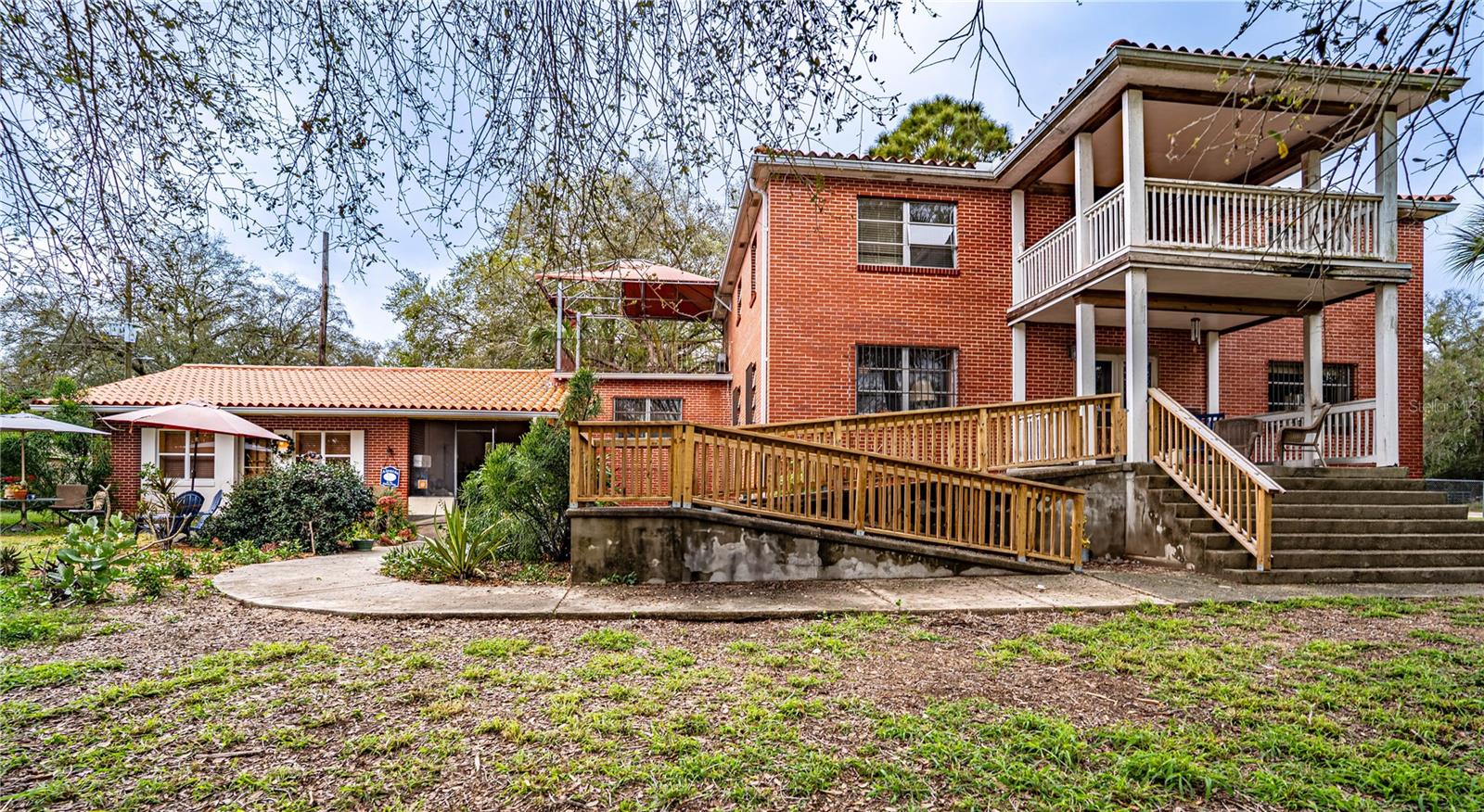 Located at 3655 N Scenic Highway in Lake Wales, FL, this remarkable property offers the perfect blend of indoor luxury and outdoor versatility. The spacious interior boasts six well-sized bedrooms and four bathrooms, providing ample room for family and guests. The formal dining room adds a touch of elegance, while the living room, featuring a charming wood-burning fireplace, creates a cozy and inviting atmosphere. The kitchen is designed for both functionality and style, making meal prep effortless.
Adding to its unique charm, this home features a full basement, offering extra space for storage, recreation, or additional living areas. With four kitchens in total—one on each level of the main home and one in each of the two private-entry in-law suites—this property is designed for convenience and flexibility. The in-law suites, currently used as Airbnbs, provide an excellent opportunity for rental income or extended family accommodations.
Step outside to discover an array of exceptional outdoor features. The level, flat lot is fully fenced and zoned for horses, featuring multiple horse paddocks for equestrian enthusiasts. The property includes several structures, such as a guest house, barn, and storage buildings, ensuring ample space for a variety of needs. Enjoy breathtaking views of Lake Starr while relaxing on the covered front porch, side porch, or private patio—all perfect for unwinding or entertaining.
For added peace of mind, the home is equipped with a full-house generator, ensuring uninterrupted power.
Whether you choose to make it your own or restore the original beauty of this home, this property offers endless possibilities in a serene and picturesque setting.
Don’t miss this rare opportunity—schedule your private tour today!