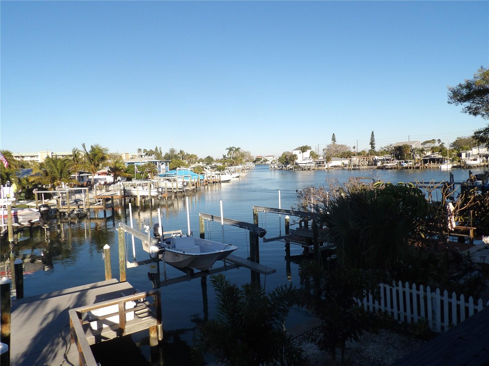waterfront on the wide open canal, located in Madeira Beach, connected with the intercostal and the great Gulf Of Mexico, owns a Triplux fully rented block concrete updated and remodeled, new floor, fresh paint, new rewiring with new electrical panels, has located in the most beautiful desirable area, minutes to John pass by your boat or driving, own a property in that location makes feel all the year, you are on vacation, John Pass is one of the centers of the heart of the vacation in Pinallea county, close. To all kinds of Restaurants, Caffe, shopping centers, boats, and jet skies rentals, close to Tyron Mall, Walmart, and Target, and within walking distance to the most beautiful beaches in America, this property could be the best investment for your future and retirement, live in one and rent the other two, bring your Boat, if you don't have one rent the boat slip with the lifter for an extra income, the triplex consists with 2 beds/2 baths, 1 bed / 1 bath and the efficiency. With four carports, easy 8-car parking, and a nice balcony and porch, enjoy sitting and watching the Dolphins playing around with the Ducks