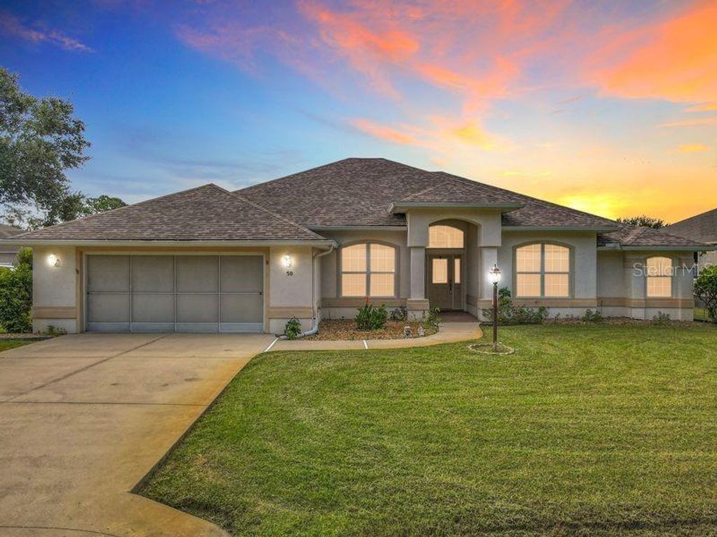 Photo of 50 Fernmill Lane, Palm Coast, FL 32137 (MLS # FC312461)