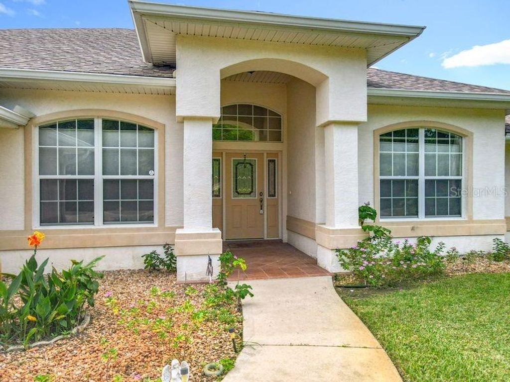 Photo of 50 Fernmill Lane, Palm Coast, FL 32137 (MLS # FC312461)