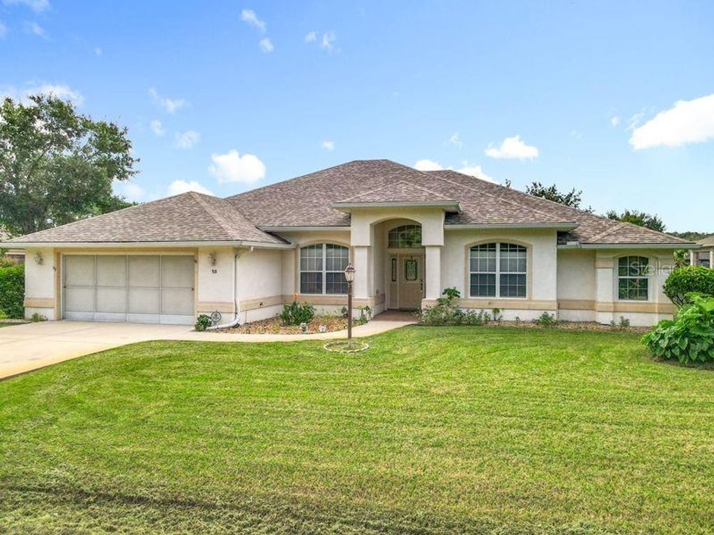 Photo of 50 Fernmill Lane, Palm Coast, FL 32137 (MLS # FC312461)