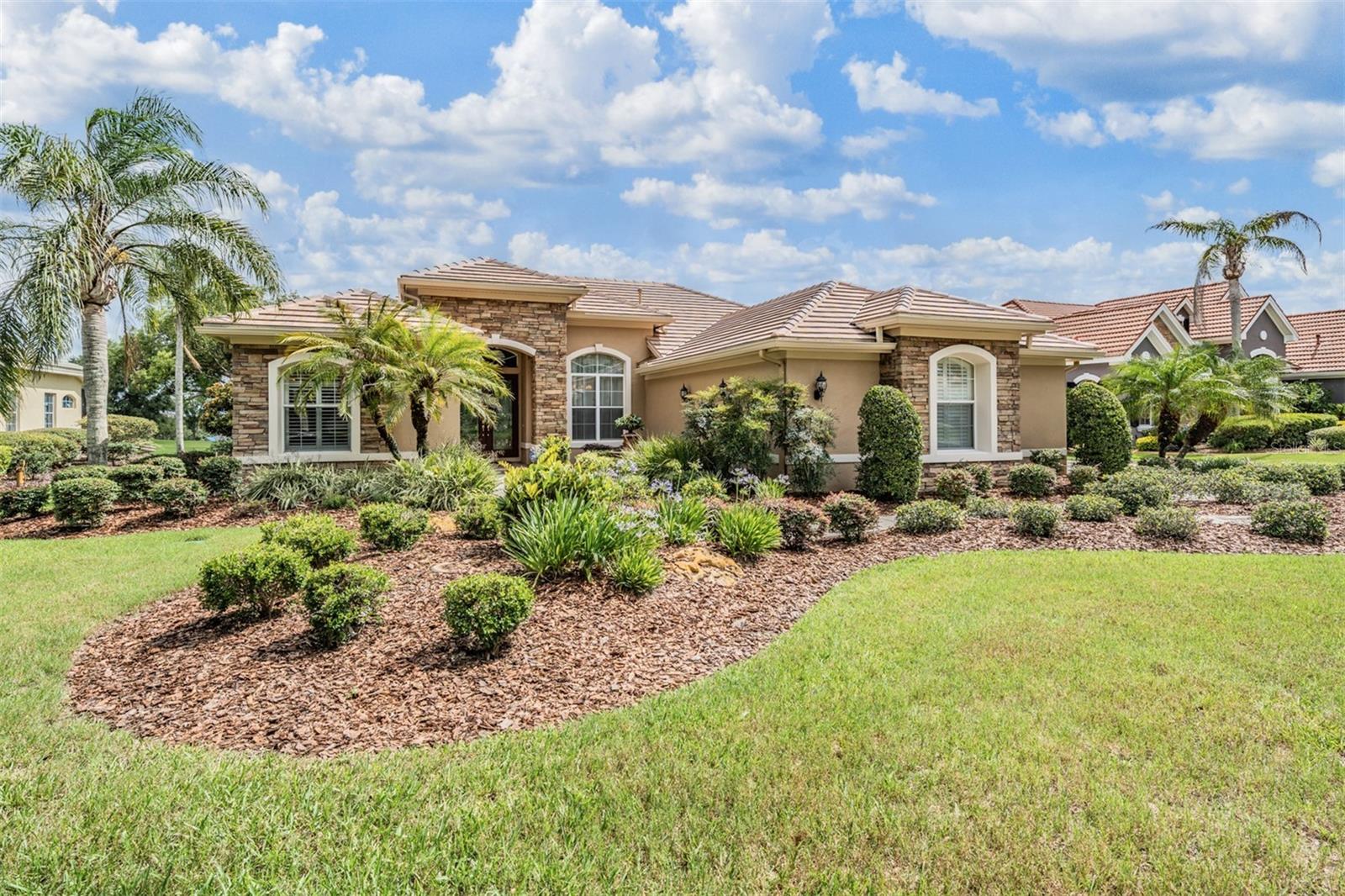 Welcome Home to this Exquisite, one owner, Custom-built Arthur Rutenberg St. Tropez II home, nestled in the prestigious Gated community of Lake Jovita Golf and Country Club! This stunning 4-bedroom, 3-bathroom residence offers 2,717 square feet of thoughtfully designed living space, complete with a spacious 3-car side-load garage expanded to 847 sq ft. Situated on a premium, level .63-acre golf course lot, the home boasts serene views of the lake and the lush fairways right from your backyard. Perfect for both relaxing and entertaining, the outdoor living area includes a heated pool with spillover spa, an automated app-controlled pool system, and a covered cabana already plumbed and vented for a future outdoor kitchen. Inside, elegant upgrades abound from ceramic tile floors laid on a running bond pattern, to tray ceilings in both the owner's retreat and great room. Expansions in the main living, dining and a secondary bedroom floor plan provides added space and flow. This home is filled with thoughtful architectural details, including a mitered bow window offering a seamless, frameless view of the pool and golf course, decorative stone accents on the front facade, and double glass entry doors that welcome you with style. The kitchen is a chef's dream with undermount lighting, pendant lights over the island and a propane gas package featuring five gas drops throughout the home. The 4th bedroom currently serves as a home office with a built out bay window in this flex space. Additional features include a new $70,000 tile roof with a 10-year warranty, 2024-installed water heater and water softener, a security system, and energy-efficient upgrades like radiant barrier insulation and a thermal shield system in the ceiling. The home is pre-wired for home theater and surround sound, has 10 ceiling fans, framed bath mirrors, window moldings in wood and marble, plus a combination of blinds, shutters, and custom fabric treatments on the windows. With recent exterior paint, refreshed pool deck, and upgraded landscaping featuring a water fountain, this home is Move-in ready and designed for luxurious Florida living. Don’t miss this rare opportunity to own a beautifully designed, well maintained home with Spectacular views, in one of the area’s premier golf communities of Lake Jovita Golf & Country Club. Low quarterly HOA fees include use of the private streets, security guard gate, walking trails with exercise stations, dog parks, playground with picnic area, grills, playground, tennis and pickleball courts and open fields for sports! Optional memberships available for the Club, Fitness, Social events, har tru clay tennis courts and jr olympic swimming pool with beach entry and swimming lanes. Located North of Tampa in the Rolling Hills of East Pasco with no CDD fees, this home combines exceptional craftsmanship with serene golf course living... Must see this hidden gem, it is a GREAT place to BE! CALL Today for your private showing!