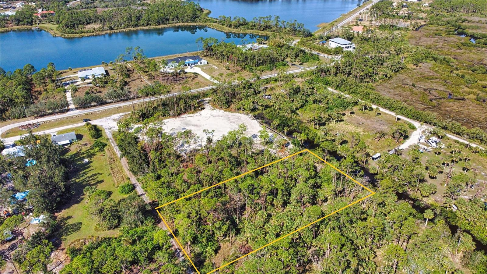 Street address is for listing purposes only and will receive an actual street address once improved. Discover a rare and exciting opportunity to design and build your dream home on this stunning residential 1-acre parcel with direct access to the Myakka River. Tucked away in a serene and private location, this property offers a harmonious blend of natural beauty and convenience. Nestled just north of the picturesque Myakka State Park, the land is bordered by pristine Florida nature, providing an idyllic setting for your future home. The property is situated on a canal leading directly to the Myakka River, offering a unique lifestyle for nature lovers, boating enthusiasts, or those seeking a peaceful retreat. Despite its secluded feel, the parcel is conveniently located just east of the highly desirable Wellen Park community, ensuring access to shopping, dining, and other everyday amenities. Looking to the future, the planned extension of River Road will further enhance the location's accessibility, providing a direct connection to the newly built high school and the pristine sands of Manasota Key Beach. This property truly offers the perfect combination of tranquility, convenience, and potential. Zoned RE1, environmental survey, no wetlands. Lot dimensions are approximate and should be verified by buyer. Please see additional parcels that are available - MLS # A4637388, A4637412 and A4637413.
