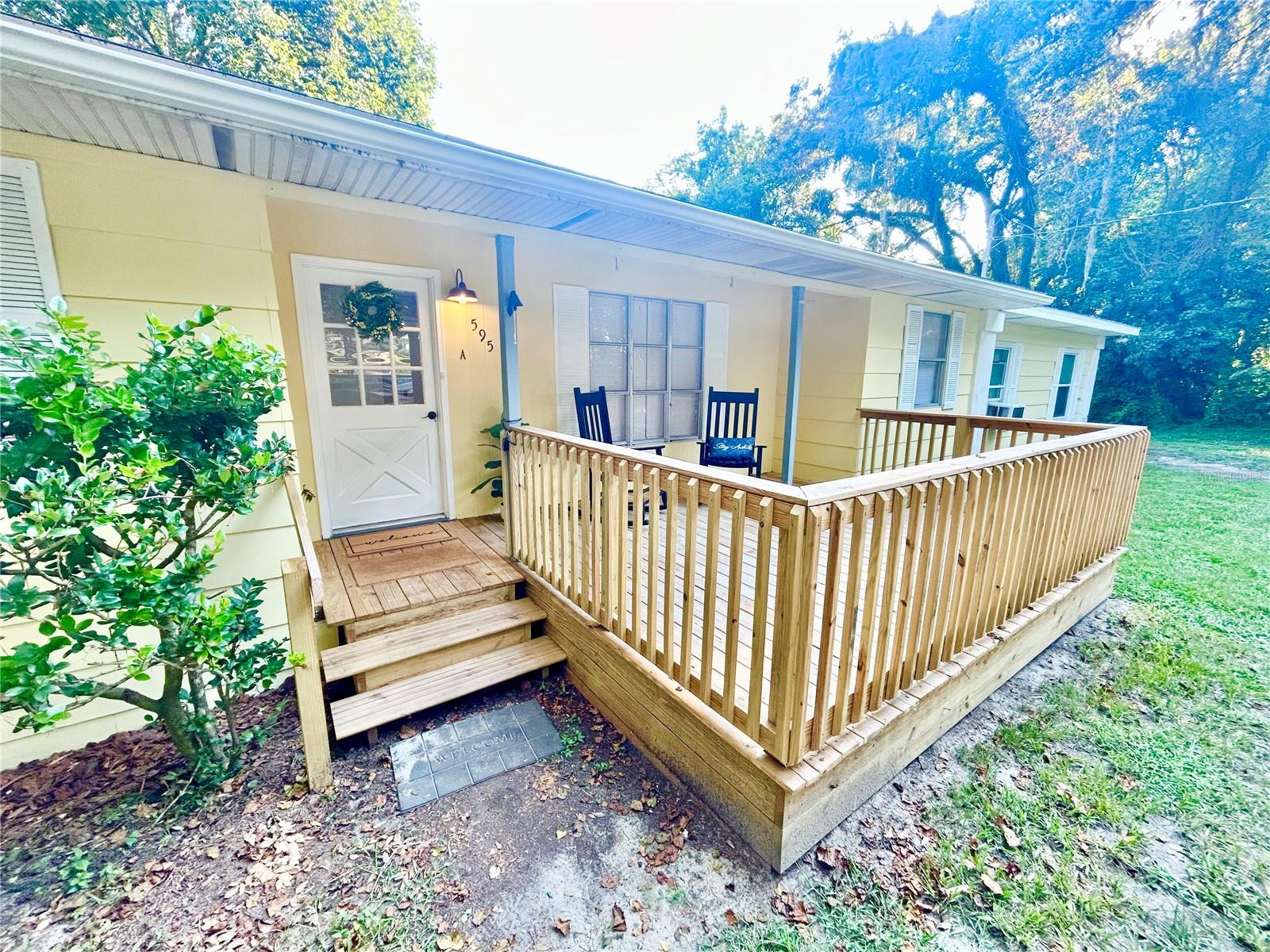 Two residences in one; perfect multi-family or mother-in-law setting! Great investment opportunity or house hack 1st time home buyer opportunity for property currently utilized as a duplex. Total: 4 bed 2 bath 1,911 living sq ft property on .62 acres that could easily be converted back to single family. Updated with new roof (2025), new well, tank, and pump (late 2023 up to code), and a newer water heater. The main unit is a 3/1 and mother-in-law suite is a 1/1 with its own kitchen & laundry. Main 3/1-unit info: new stainless Frigidaire appliances (fridge, dishwasher, & electric oven, range (2025), new plumbing (2025), new sink & counters (2025), new flooring (2025), new bathroom shower (2025), new vanity (2025), new outlets/switches/ light fixtures (2025), and new porch/wood deck (2025), new plumbing/ hookup for laundry (2025). Mother-in-law suite has its own kitchen, bedroom, bathroom, dining room, living room, laundry room, high ceilings, and separate heating & air from the main unit. Surrounded by beautiful land, horse farms with a quiet country feel yet close to the city. Only 10 minutes to downtown Ocala; Easily reach Hwy 441 and I-75 to go to Ocala or Gainesville.