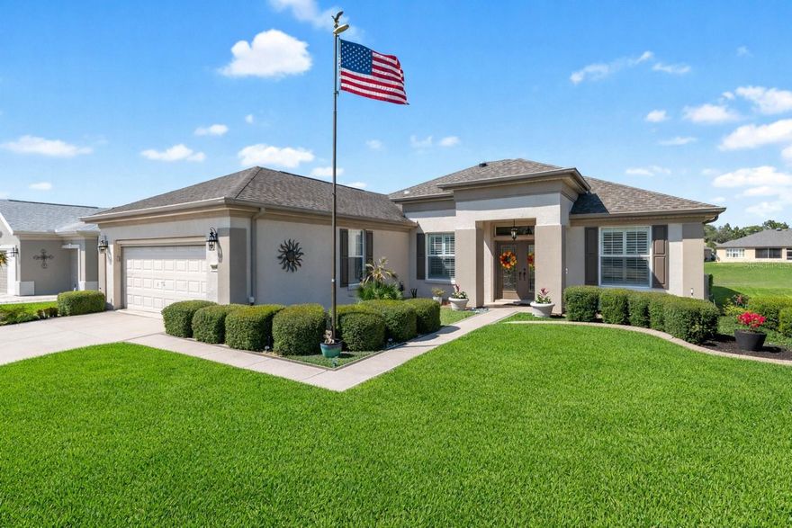 How about a 10-acre backyard that is maintenance free, you do not have to care for?? 
This beautifully upgraded Johnstown model features a custom-coated driveway and walkway leading to an elegant double-door foyer with decorative cut glass inserts. Inside, you’ll find a private library with French doors, crown molding, and thoughtful finishes throughout.
The climate-controlled, north-facing tiled lanai is enclosed with full-length thermal pane glass windows, creating a perfect year-round retreat. Natural light fills the home through two solar tubes, enhancing the bright and airy feel.
The kitchen is equipped with granite countertops, white cabinetry, and stainless steel appliances. The primary suite boasts a luxurious custom walk-in Roman shower and upgraded double vanities with quartz countertops.
Additional upgrades include new ceiling fans, a remodeled guest bath with a granite countertop, and NEW durable vinyl plank flooring throughout the home. The extended garage features an epoxy-coated floor and overhead storage racks for added convenience.
Outdoor living shines with a beautiful paver patio accented by a palm tree island, easy-care stone landscaping, concrete curbing, and even a flagpole. Energy-efficient features such as a solar attic fan and whole-house water filtration system add even more value.  ROOF – 2020  HVAC - 2016  AWARD-WINNING Del Webb Spruce Creek Golf & Country Club is a GATED, 3,250 home, +55 Community with over 70 clubs, 3 pools, 3 spas, a Clubhouse, a Fitness Center, Bocce Ball, Shuffleboard, 12 Pickle ball Courts, 7 Tennis Courts, Sand Volleyball, Water Volleyball, Lake Vista Gazebo, Pavilions, Walking Paths and so much more! Come see this beautiful community with a GORGEOUS Tree Canopy on the Boulevard and its Restaurant, Liberty Grille. Come, enjoy the four (4) 9-hole Golf Courses today and begin living your BEST LIFE! DON'T WAIT TO SEE THIS SHOW QUALITY HOME! 
This is a very special home…Don’t miss it!
