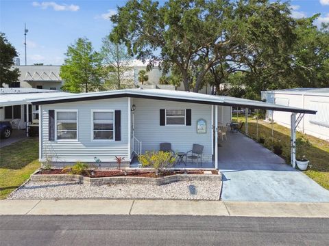 Photo of 66 Royal Palm Circle, Largo, FL 33778 (MLS # TB8373489)