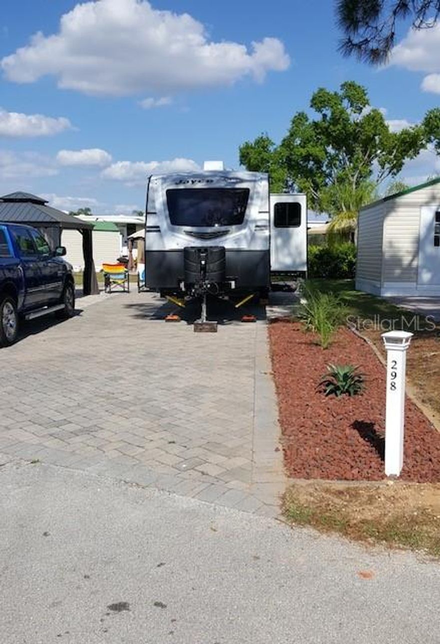 This perfect RV lot is near the pool in the much sought-after Elite Resorts at Citrus Valley. Lot 298 is located on the quiet back street It is a spacious lot with extra pavers that has plenty of room to make it your own piece of paradise. The lot has a 10x12 shed with electricity and water that also includes a LG full size W/D, chest freezer, wine cooler, shelfs and a gazebo with new curtains, separate ele. post, propane fire table, ceiling fan, retractable TV mount.   The association allows RV's, sheds, ParkModels with porches and gazebos. A well maintained high quality resort that is only approximately 12 miles from Disney and 13 miles from the quaint downtown Clermont area with weekly farmers markets, food truck events and more. The resort also has two bath houses, laundry facilities, social events and entertainment. This property has the ability for short term rental to either use it part time and rent it the remanding the time or stay full time yourself. Call or email Diana for more information.