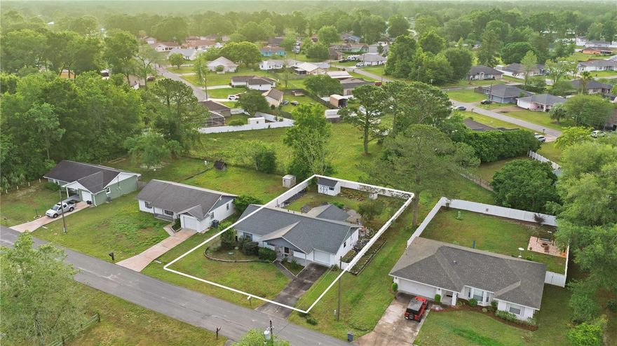 NO HOA & NOT in a flood zone! This adorable Concrete Block home offers a desirable floor plan with a fully fenced vinyl backyard and no rear neighbors, plus a county-maintained lot behind for added privacy. Major updates include a 2023 ROOF & 2025 AC. The interior features a combination of tile and wood flooring, with carpet in the two guest bedrooms. The kitchen is equipped with wood cabs, solid surface countertops & a convenient lazy Susan. A huge indoor laundry room provides additional storage and functionality, with direct access to the backyard & garage. Don't miss this one, make your appointment today!  Estate Sale on April 23rd, 24th & 25th.