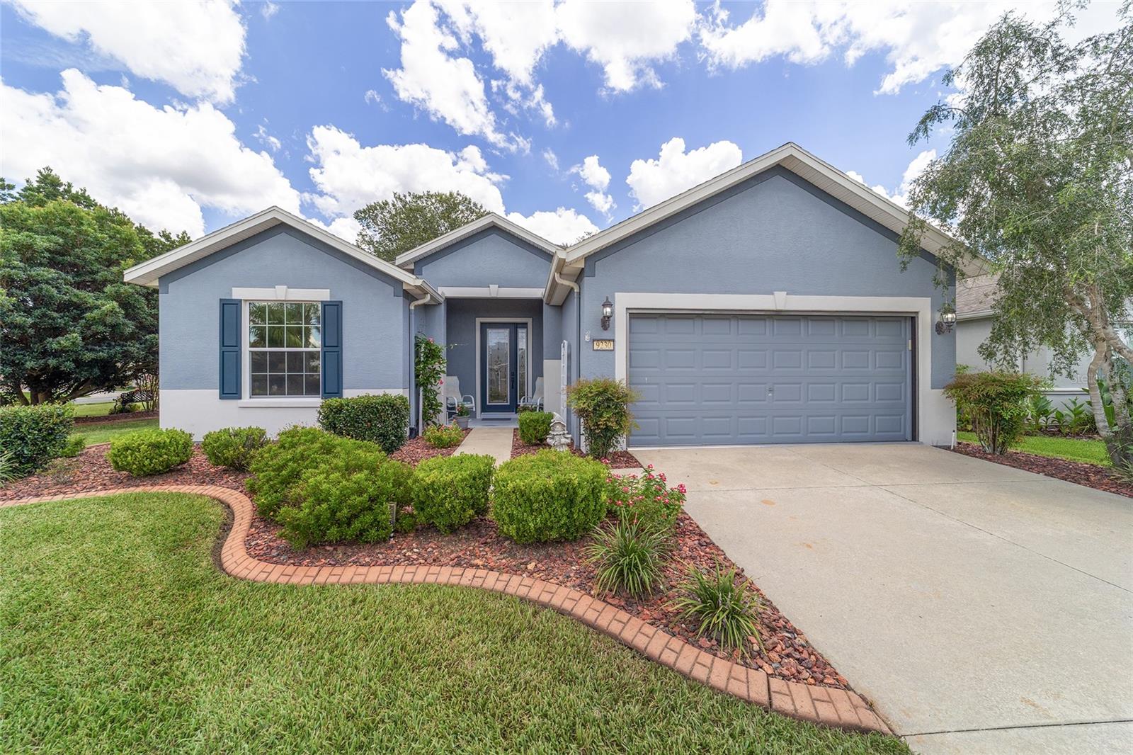 Step into easy living with this beautifully maintained 3 bedroom, 2 bath Sheridan model with 2 car garage in the sought-after, amenity-rich community of Del Webb Stone Creek. This move-in ready home is the perfect alternative to waiting on new construction and is on an oversized corner lot, complete with mature landscaping and beautiful gardens throughout entire yard. Inside, you'll find a light-filled open-concept layout with neutral finishes and luxury vinyl plank flooring, all replaced in 2022. The spacious kitchen features solid surface countertops and stainless steel appliances new in 2022, and a large center island, perfect for casual dining or entertaining. The inviting living room and breakfast nook open to a fully enclosed lanai through two sets of sliding glass doors, complete with custom solar shades for year-round comfort. Just beyond, an extended patio offers the perfect spot for grilling or relaxing in the Florida sunshine. Enjoy peace of mind with numerous recent upgrades including a new roof (2022), new A/C (2021), water softener (2022), fresh interior and exterior paint (2022) and garage screen. Located in a gated, 55+ community, this home offers internet and trash pickup through the HOA and 24 hour security at the gate. Amenities include heated indoor and outdoor pools, spa, jacuzzi, championship golf, two expansive clubhouses, fitness center, dog parks, and courts for pickleball, tennis, bocce and more. With walking trails, lakes, and a wide variety of clubs and events, every day here feels like a vacation. Don't miss this opportunity to live the Stone Creek lifestyle! Schedule your private showing today!