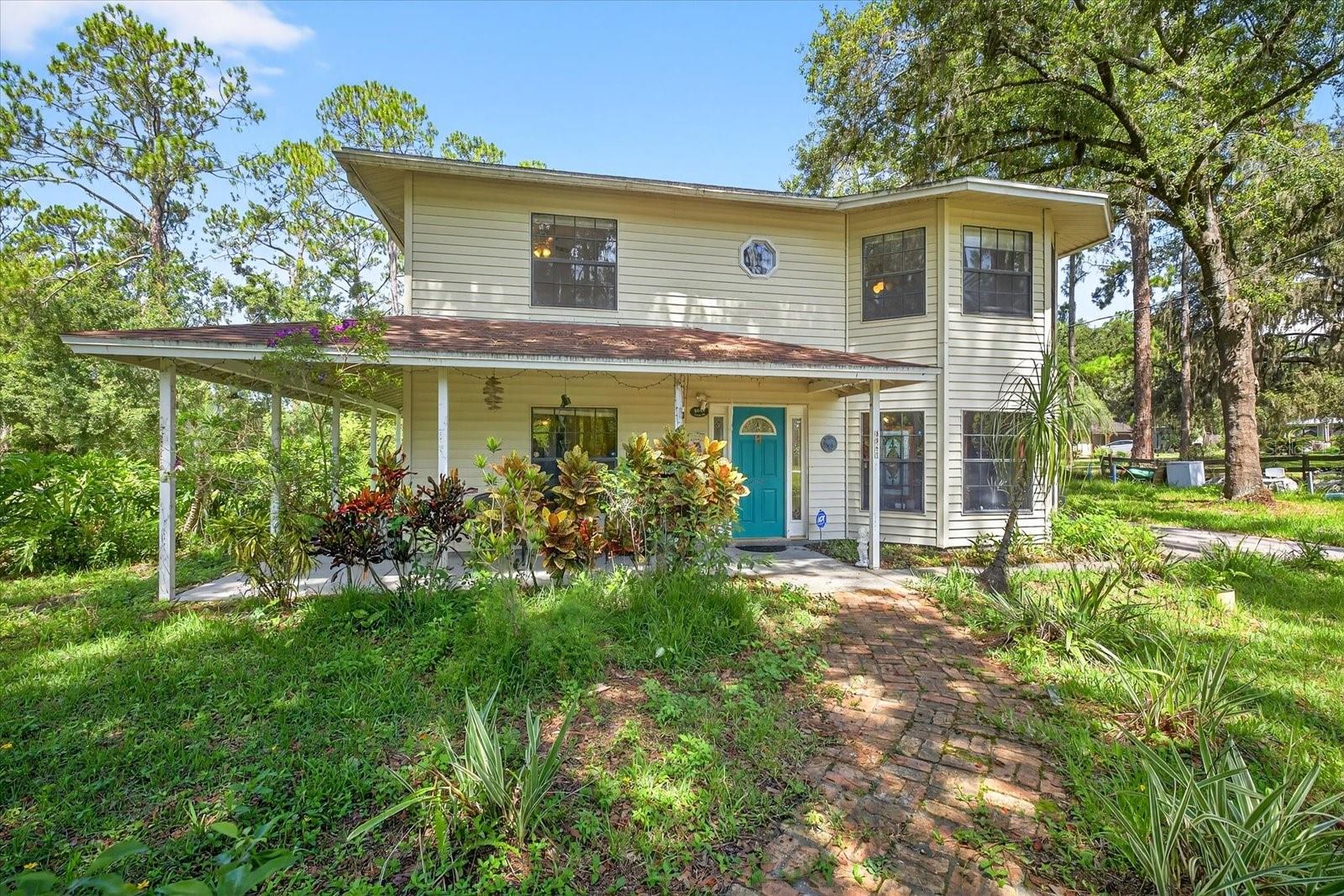CALLING ALL INVESTORS, PROJECT BUYERS, & BUYERS WHO WANT TO TURN THIS POOL HOUSE WITH GREAT BONES & OVERSIZED LOT INTO A DREAM FARM HOME! This UNBEATABLE OPPORTUNITY is sitting on OVER ½ ACRE of land in Wesley Chapel, Florida with plenty of room to grow! This RARE 2-STORY RANCH-STYLE HOME features 3 bedrooms, 2 bathrooms, a large 28x12 master suite that could easily be CONVERTED INTO A 4TH BEDROOM, an in-ground POOL, a JACUZZI SPA, a WRAPAROUND PORCH, and real hardwood and travertine tile flooring throughout the first floor. The updated, REMODELED KITCHEN adds to the charm and functionality of this unique property. Whether you're looking to RESTORE THIS PROPERTY as a luxury homestead, pursue YOUR NEXT RENOVATION PROJECT, or create a secluded farmhouse oasis, the POTENTIAL IS ENDLESS. Surrounded by nature with NO HOA, NO CDD, and NO DEED RESTRICTIONS, you can enjoy peaceful country living while staying CLOSE TO THE CITY's vibrant amenities. The Home is NOT IN A FLOOD ZONE! The 2018 ROOF is in mint condition, but the Pool Enclosure & Flat roof experience Wind Damage from Hurricane Milton/Helen—this is your chance to bring this beauty back to life! There is truly nothing like this available in Tampa Bay, especially at this price point! Home is tucked off a private road yet just minutes from I-75, top-rated schools, shopping, restaurants, malls, and the iconic 7-Acre Epperson Lagoon. CASH, CONVENTIONAL, RENOVATION, OR HARD MONEY OFFERS ARE ALL WELCOME. SOLD AS IS! This is a GREAT VALUE, and perfectly suited for discerning buyers ready to make their mark. DO NOT HESITATE—opportunities like this do not last. All information deemed accurate but not guaranteed; buyer to verify.