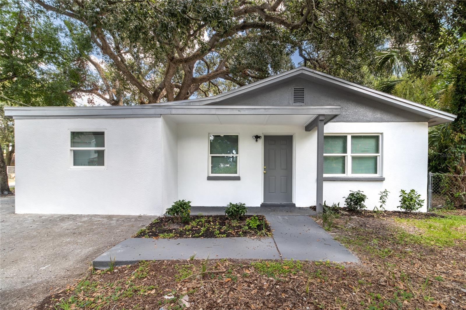 One or more photo(s) has been virtually staged. Welcome to 30th Street — a fully renovated 4-bedroom, 2-bathroom home nestled in the heart of Tampa’s sought-after 33610. With a complete top-to-bottom transformation, this home delivers fresh design, everyday comfort, and the kind of move-in-ready appeal that’s hard to find.
From the moment you arrive, the freshly painted exterior and clean lines present a welcoming first impression. Step inside to discover a bright, open floor plan with brand-new flooring, modern baseboards, and a seamless flow from room to room — perfect for relaxing or entertaining.
The kitchen is a true centerpiece, featuring all-new stainless steel appliances, sleek quartz countertops, and a contemporary layout that opens to the living and dining spaces. Both bathrooms have been tastefully redesigned with stylish finishes and a crisp, modern look that enhances the home’s fresh feel.
The spacious backyard provides plenty of room to unwind, entertain, or expand — whether it’s a future garden, play area, or extra storage, the possibilities are wide open.
Ideally located just minutes from downtown Tampa, and close to major highways like I-75 and I-275, this home gives unbeatable convenience with access to shopping, dining, and everything Tampa Bay has to provide.
Whether you're a first-time buyer, growing household, or investor looking for a turnkey opportunity — this home delivers comfort, style, and value in one of Tampa’s fastest-growing areas. Don’t miss your chance to make it yours.