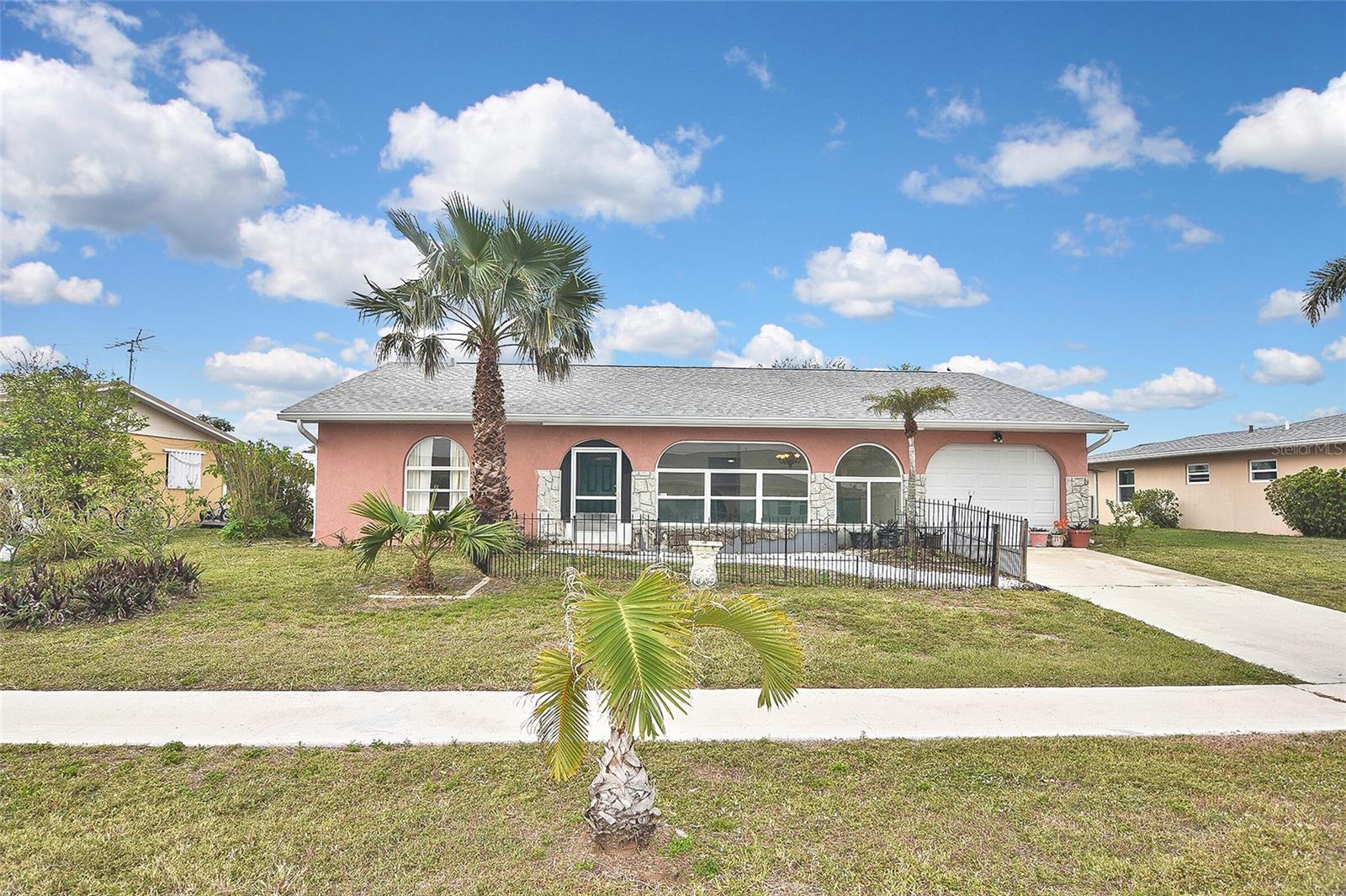 Welcome to your perfect retreat, featuring a Pool House and Spa! This home offers a tranquil escape while still being conveniently close to all the amenities you need. As you enter, you'll be greeted by an open-concept layout that seamlessly connects the living, dining, and kitchen areas, creating a spacious and inviting atmosphere. The kitchen is equipped with appliances, ample counter space, and a handy breakfast bar, making meal prep easy and enjoyable. The bedrooms are designed for comfort and privacy, providing a peaceful space to unwind. The master suite includes a walk-in closet and a private en-suite bathroom for your convenience. Step outside to the screened lanai and enjoy the Florida sunshine in your own outdoor paradise. The beautifully maintained backyard offers a serene space for relaxation or entertaining guests. Located in a quiet neighborhood, this home offers a sense of peace and privacy, while still being just a short drive from shopping, dining, parks, and more. The home features large windows that let in plenty of natural light, creating a bright and airy feel throughout. The charming exterior showcases exceptional curb appeal, with a lovely, landscaped front yard and welcoming entrance. The attached garage provides easy parking and additional storage space. No HOA. NO CDD.