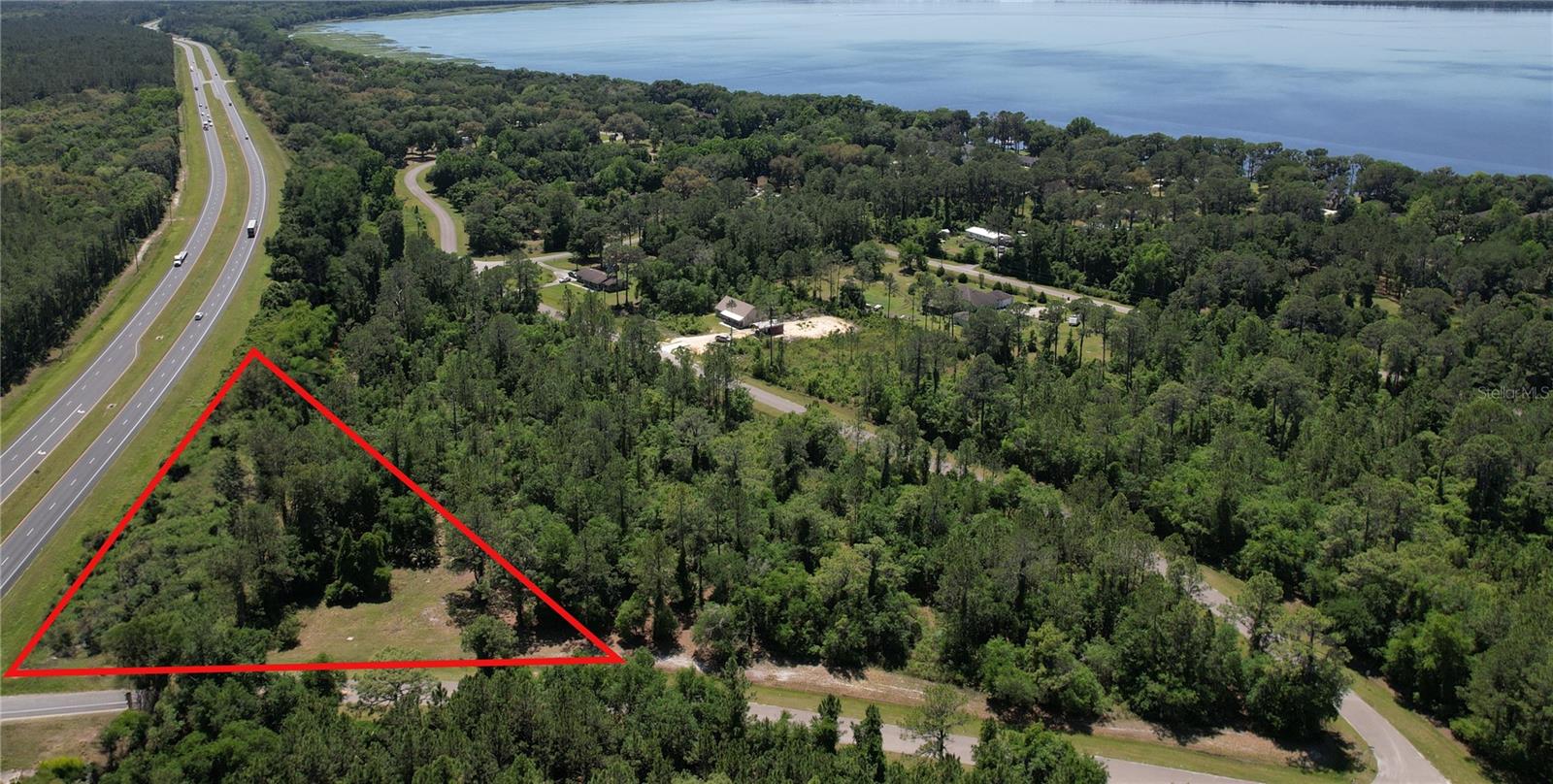 One or more photo(s) has been virtually staged. 1.18 acre buildable lot! Discover the epitome of Florida living on this vacant lot just moments from the shores of Lake Lochloosa. Home to some of the best fishing in Florida and so much more... Positioned mere minutes from Gainesville, home to the esteemed University of Florida, and within easy reach of Ocala, this parcel of land offers both convenience and tranquility. Ask for details or call for your VIP tour!