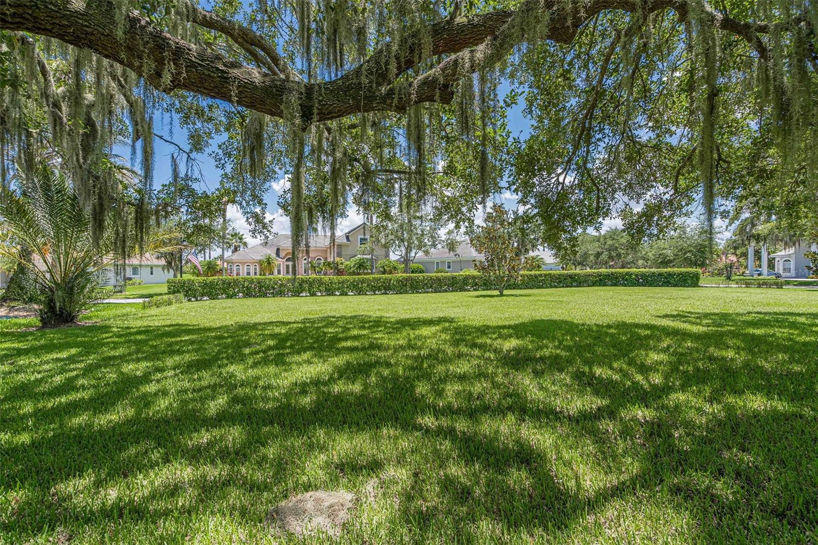 GOLF COURSE * VACANT LOT in KISSIMMEE BAY - BRING YOUR OWN BUILDER or WE CAN PROVIDE YOU WITH A LIST. The perfect opportunity to build your dream home on this corner lot with irrigation(recycled water) on Kissimmee Bay Circle in a popular golf course community boasting 18 holes of pure enjoyment. Positioned strategically on the #2 green and #3 tee box, this gated community offers exclusivity and security. The 1/3 +/- acre lot provides ample space while backing up to the serene golf course, offering tranquil views. Enjoy the convenience of a marina on the shores of East Lake Tohopekaliga and relish in a maintenance-free lifestyle with included WiFi and Cable in the HOA dues. This haven also features storage for your RV, a private boat ramp, and captivating community amenities such as pickleball, tennis, basketball, playground and a neighborhood tavern—all just a golf cart ride away. Explore the survey, video, and details provided, and schedule your showing today to seize this unparalleled opportunity. Don't miss the chance to experience luxury living close to top attractions, the international airport, beaches, and scenic travel routes. Scheduling your showing today to envision your ideal lifestyle in this exceptional location.